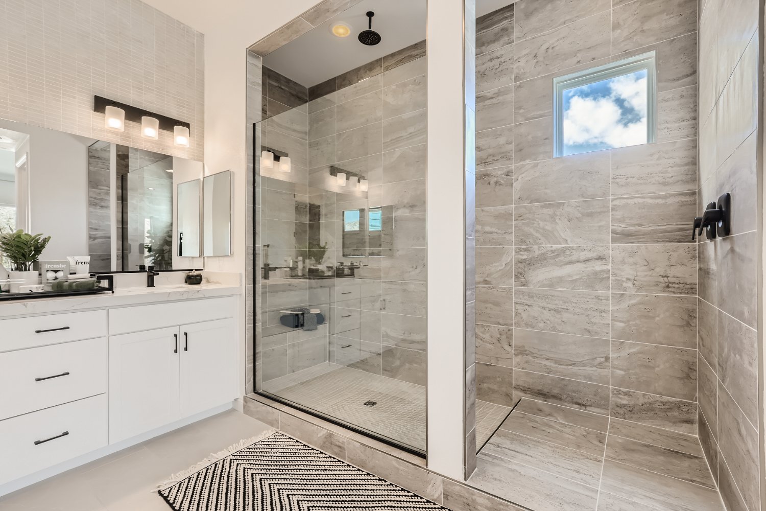 A bathroom with a glass shower.