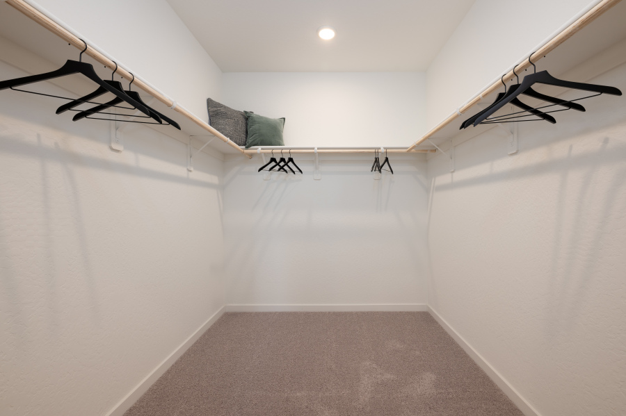 A room with white walls and a staircase.