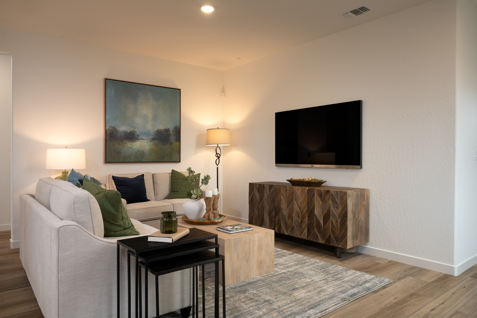 A living room with a tv and a coffee table.
