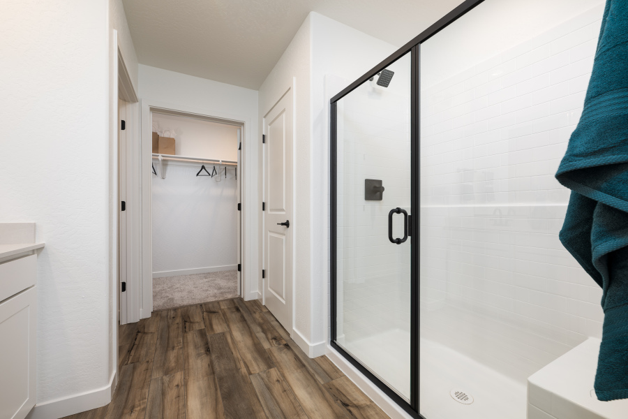 A closet with a glass door.