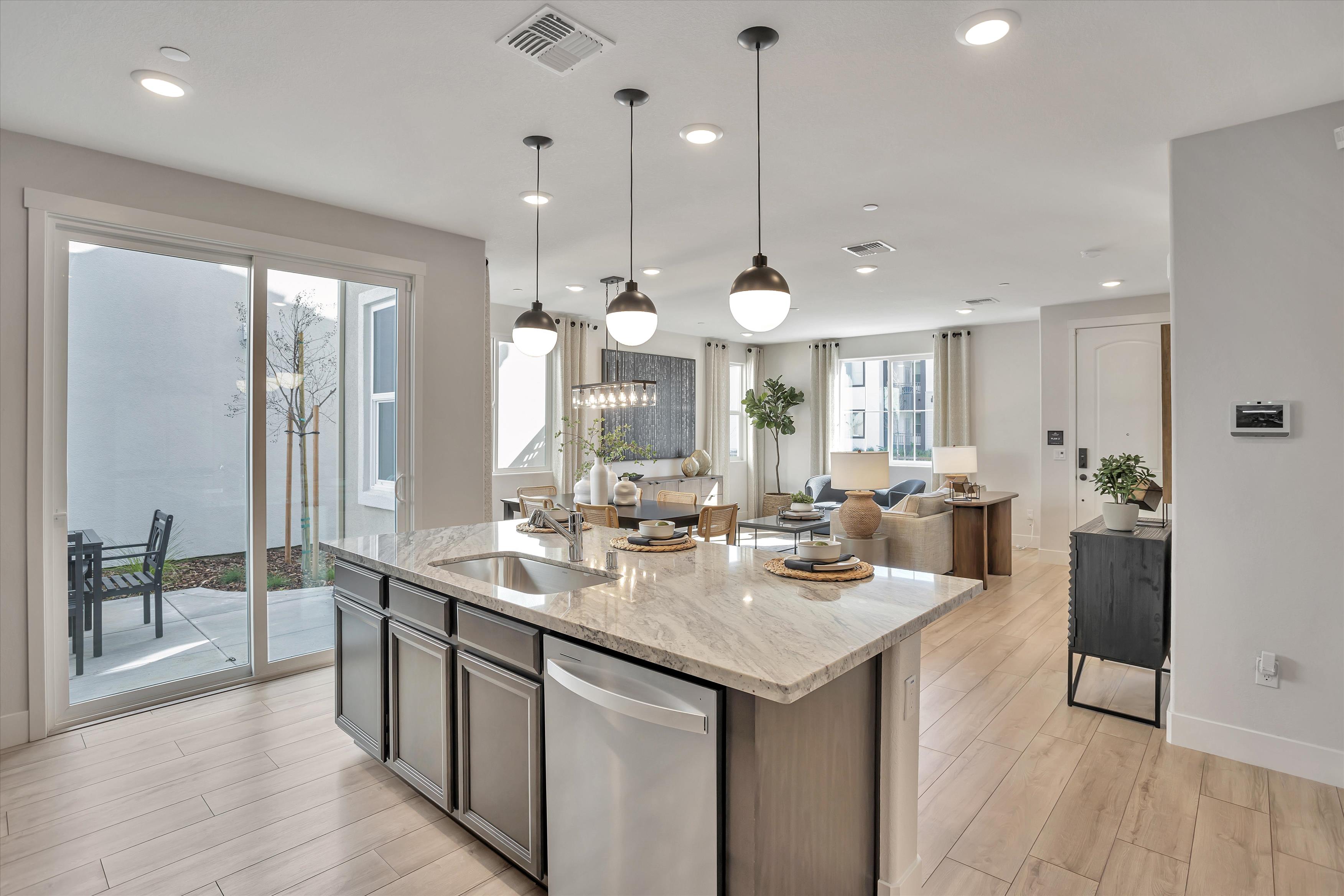A kitchen with a marble island.
