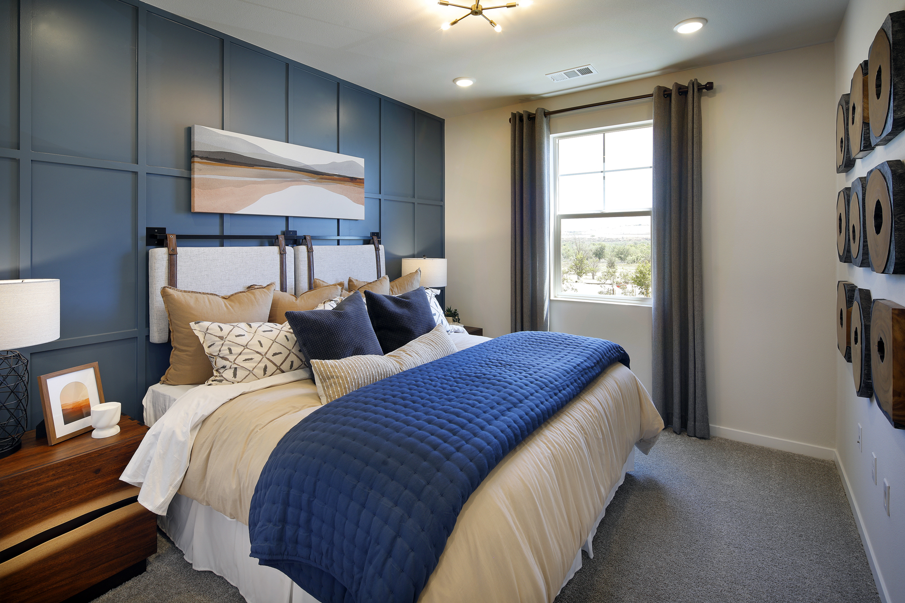 A bedroom with a bed and a window.