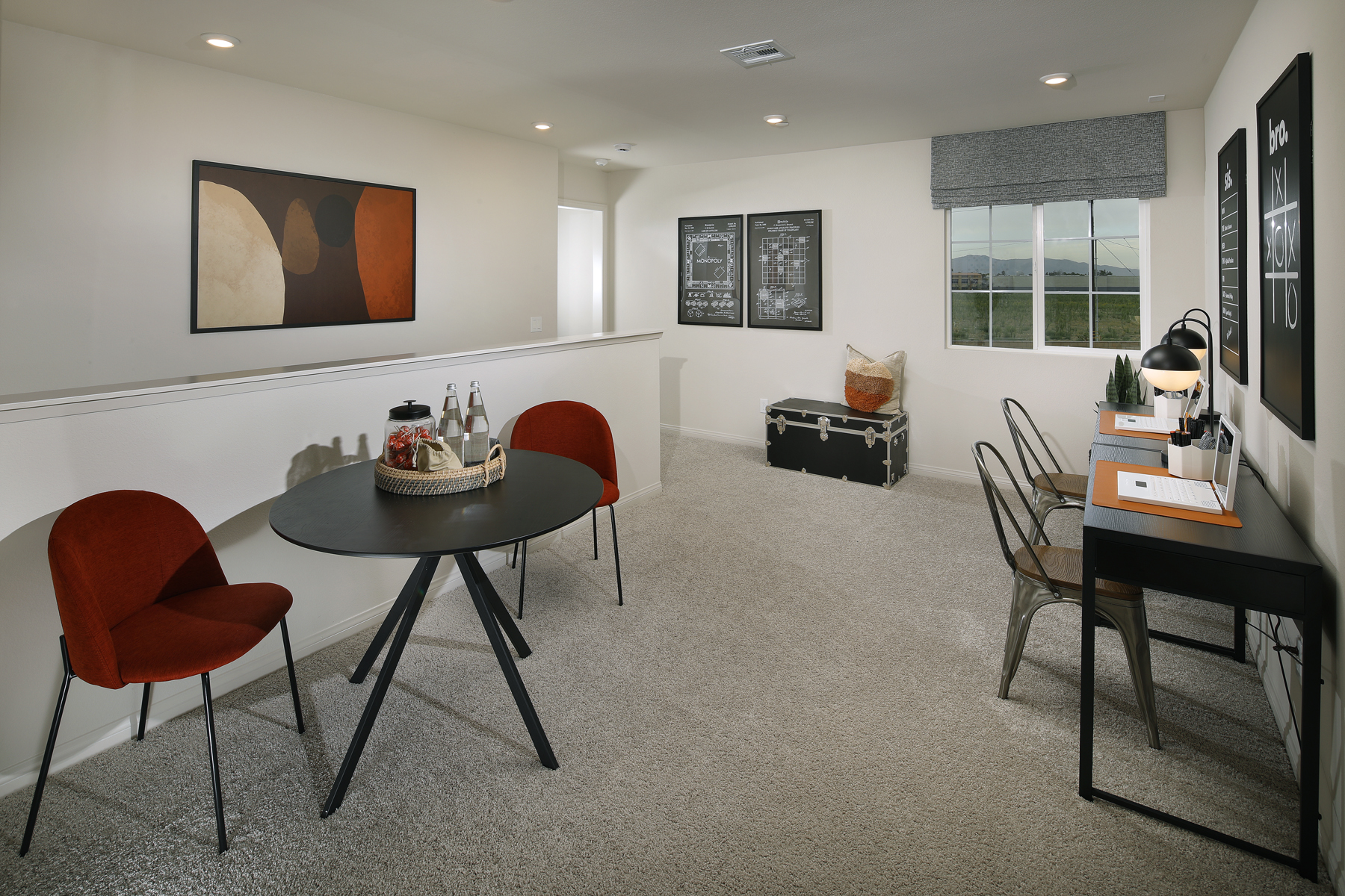 A room with a table and chairs.