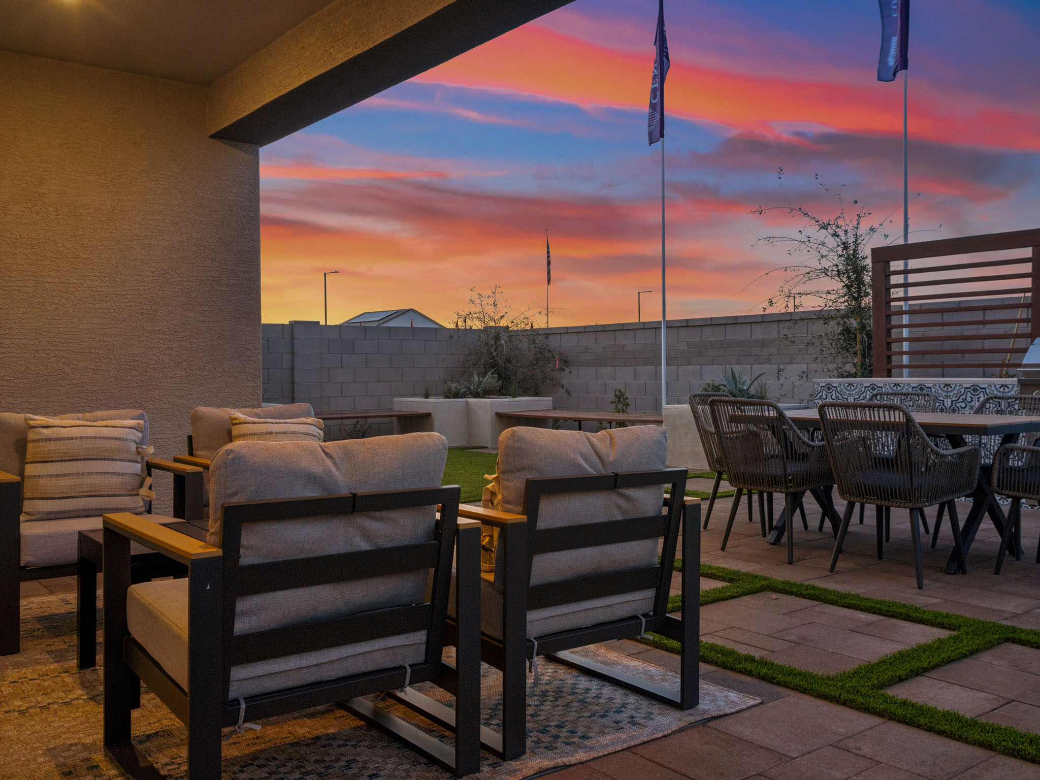 A patio with chairs and tables.