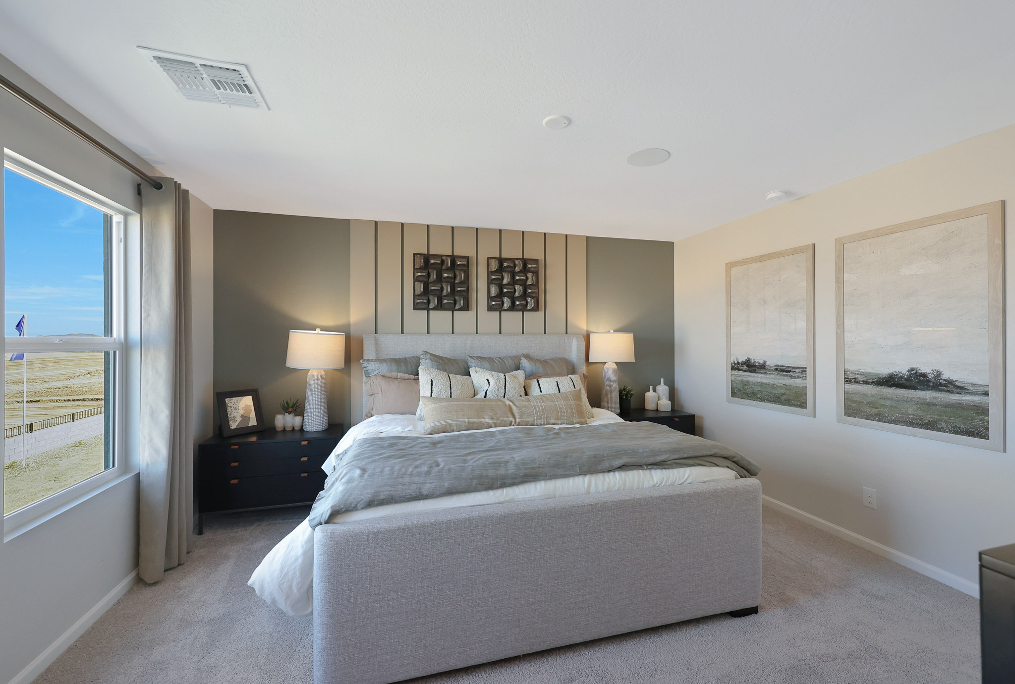 A bedroom with a large bed.