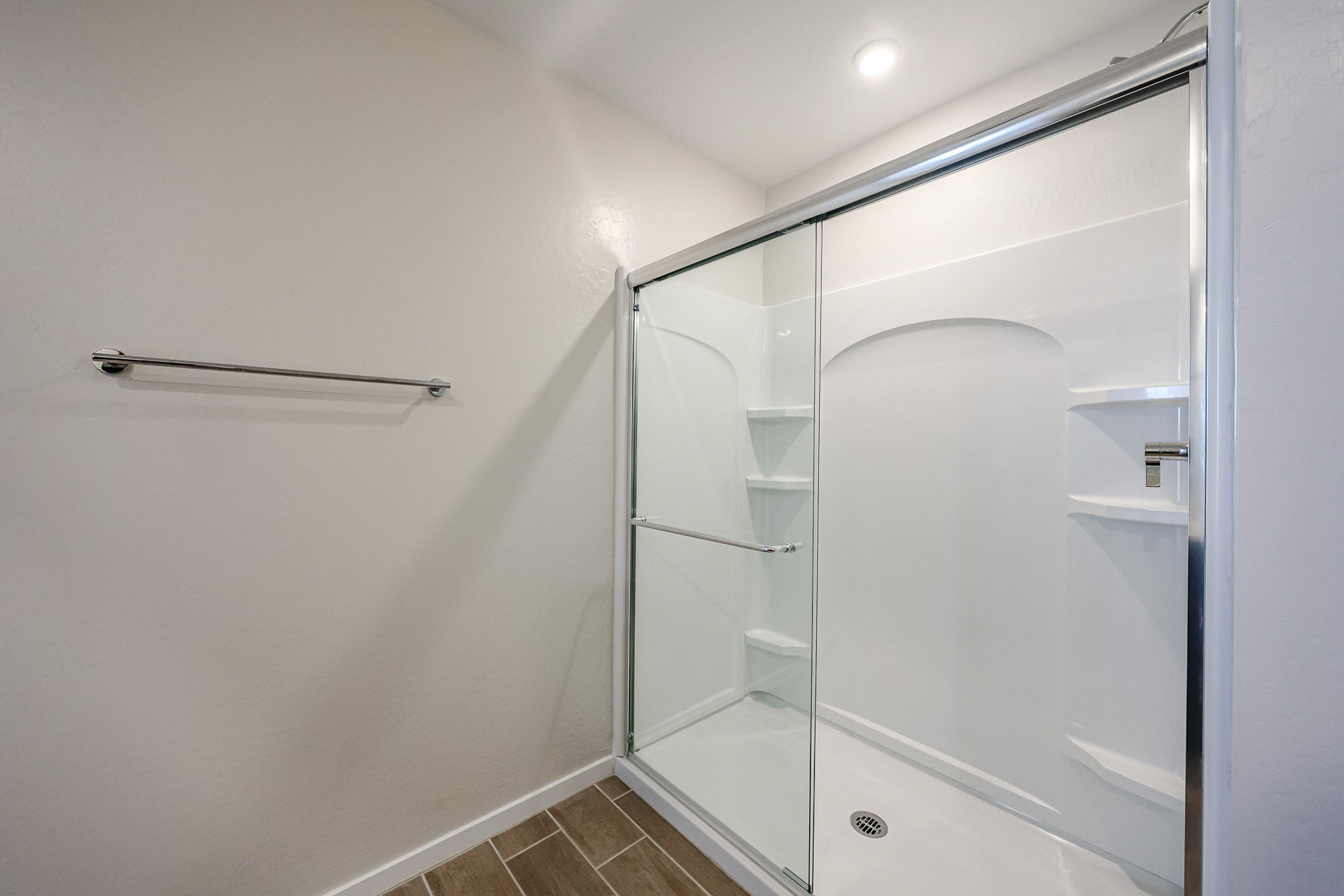 A shower unit in a bathroom.