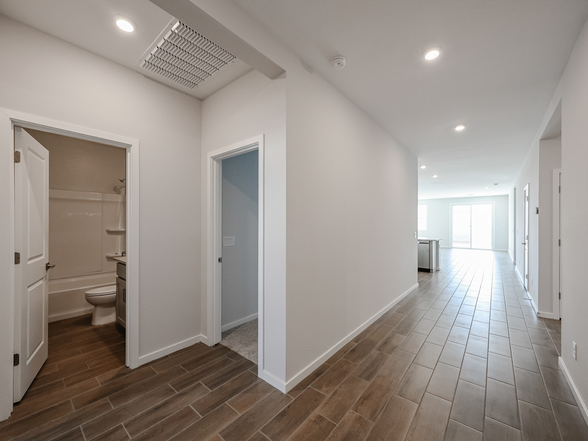 A bathroom with white walls.