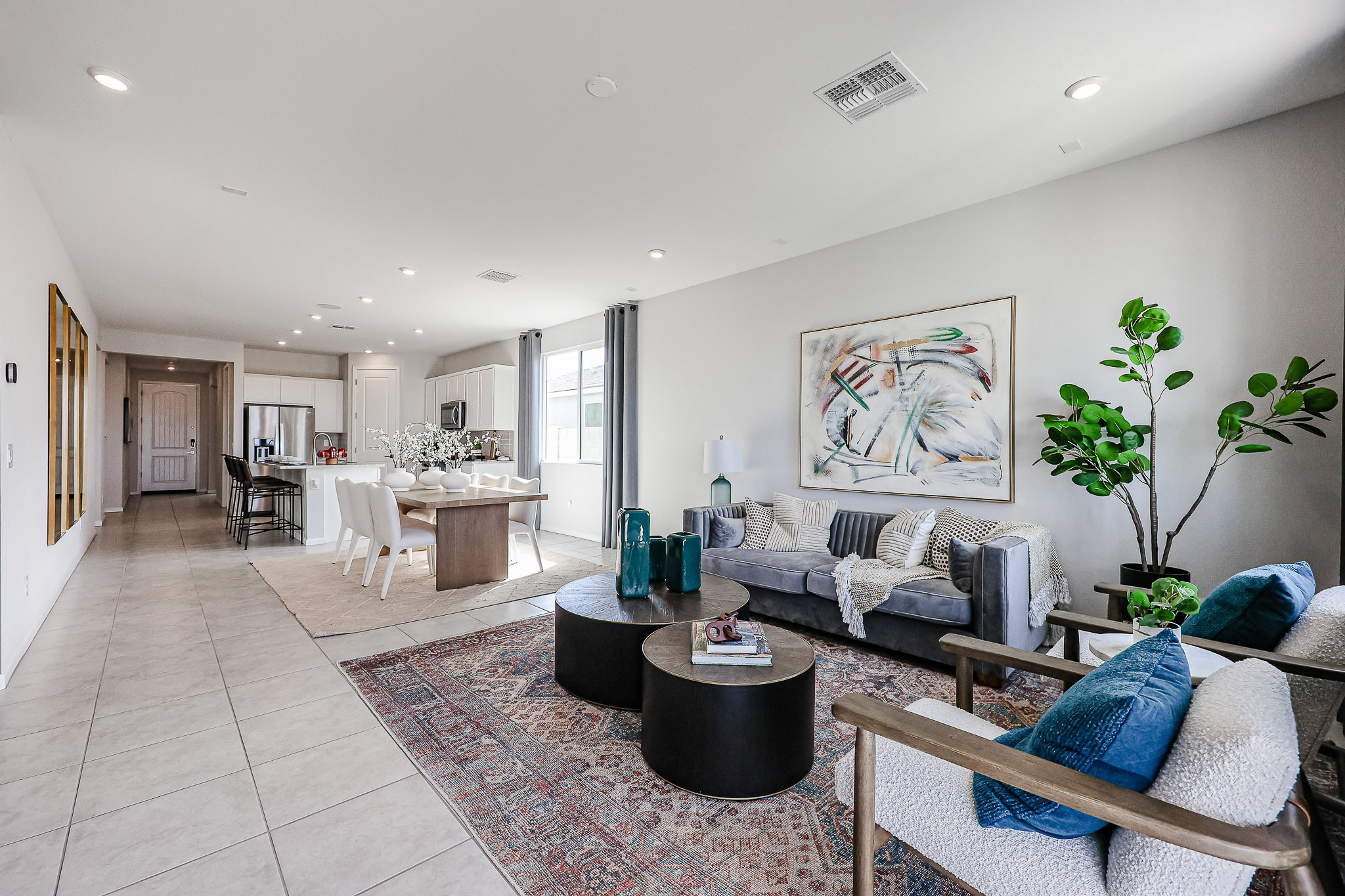 A living room with a couch and chairs.