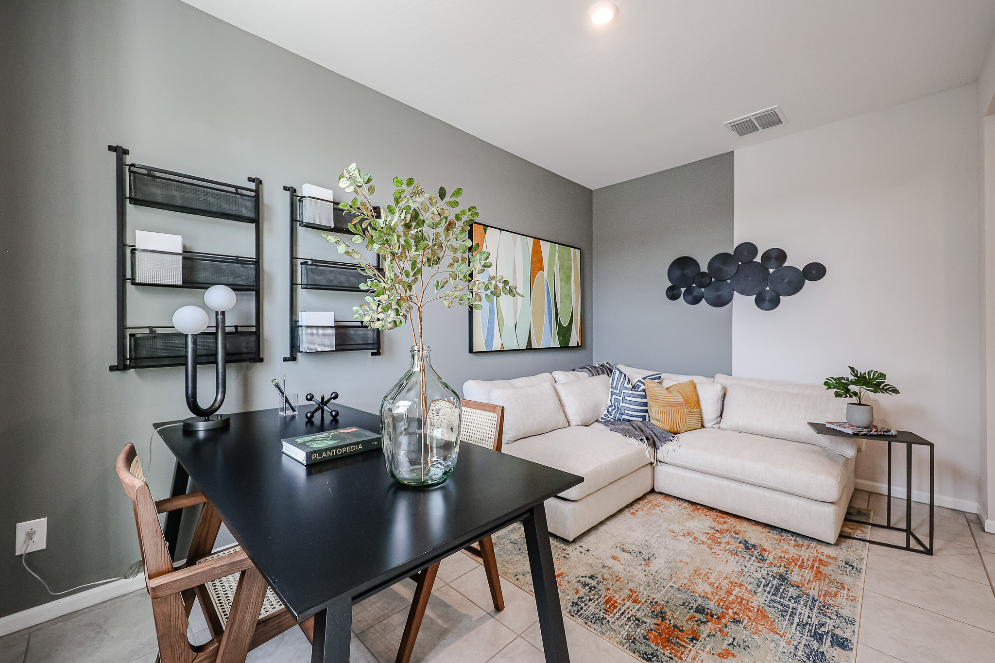 A living room with a couch and a table.