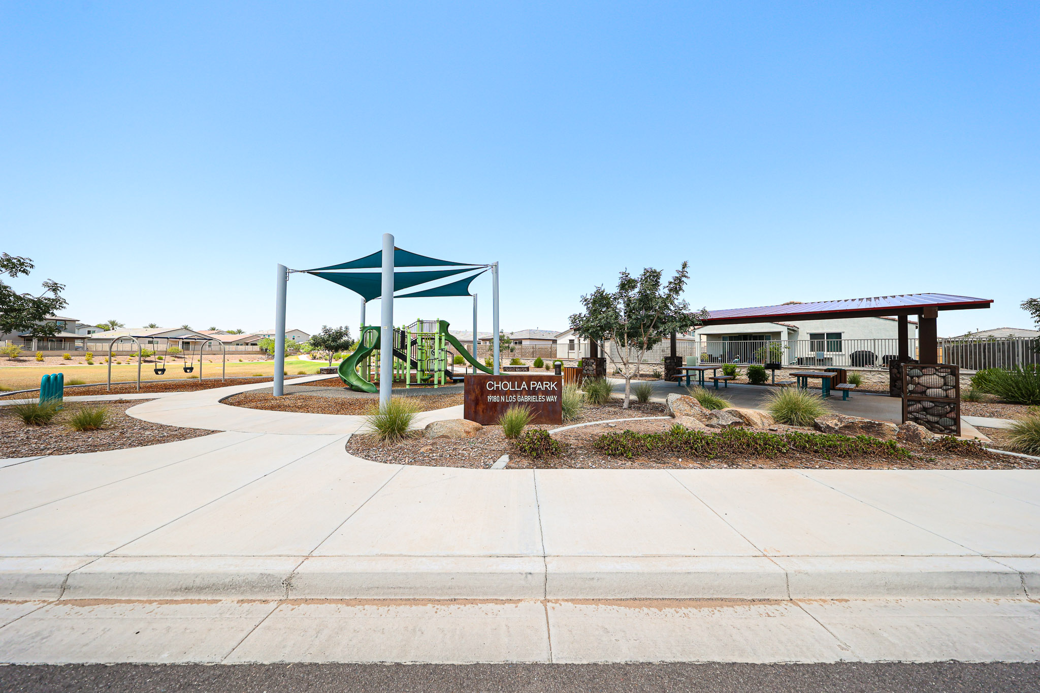 A basketball court in front of a building.