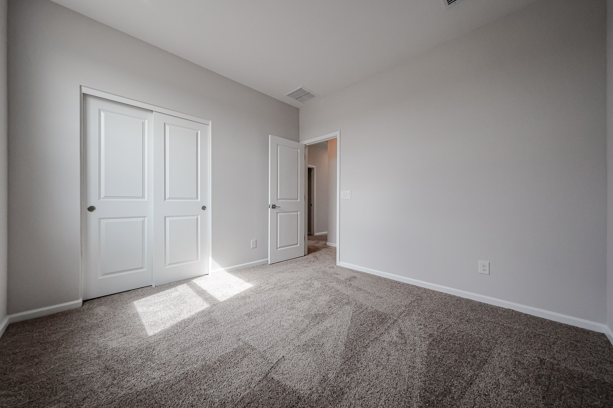 A room with white doors.
