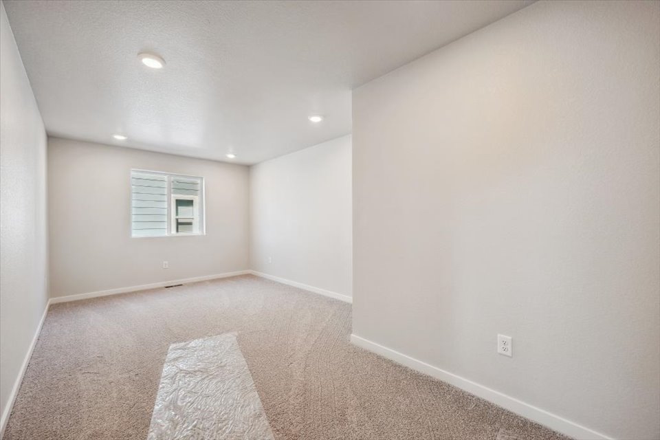 A room with a rug and a rug.