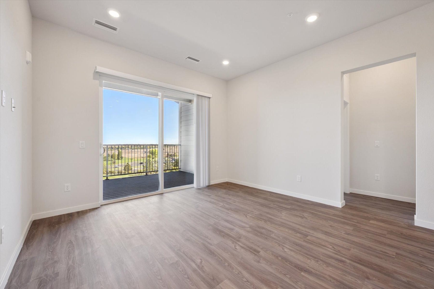A room with a wood floor and a wood floor with a wood floor.