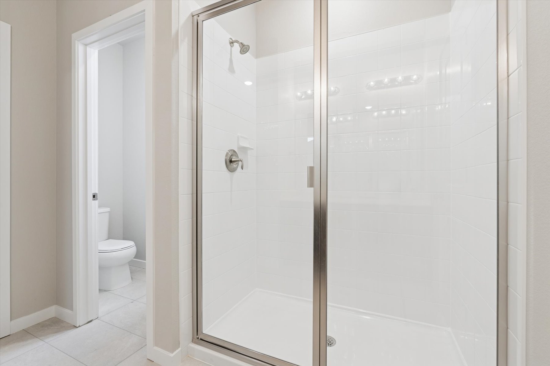 A bathroom with a glass shower.
