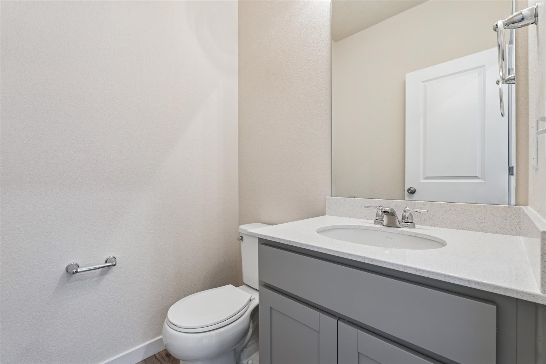 A bathroom with a sink and toilet.