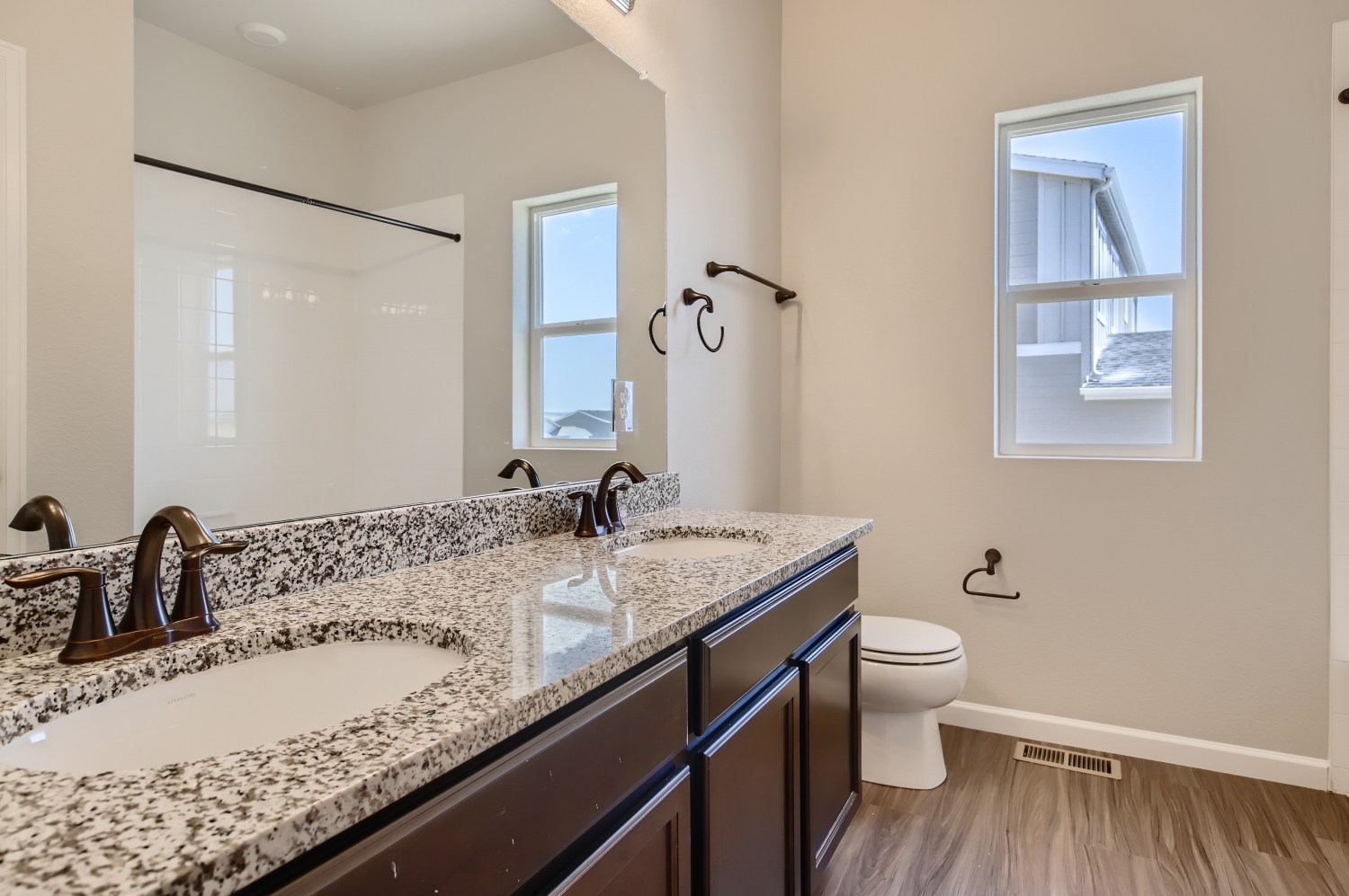 A bathroom with a marble countertop.