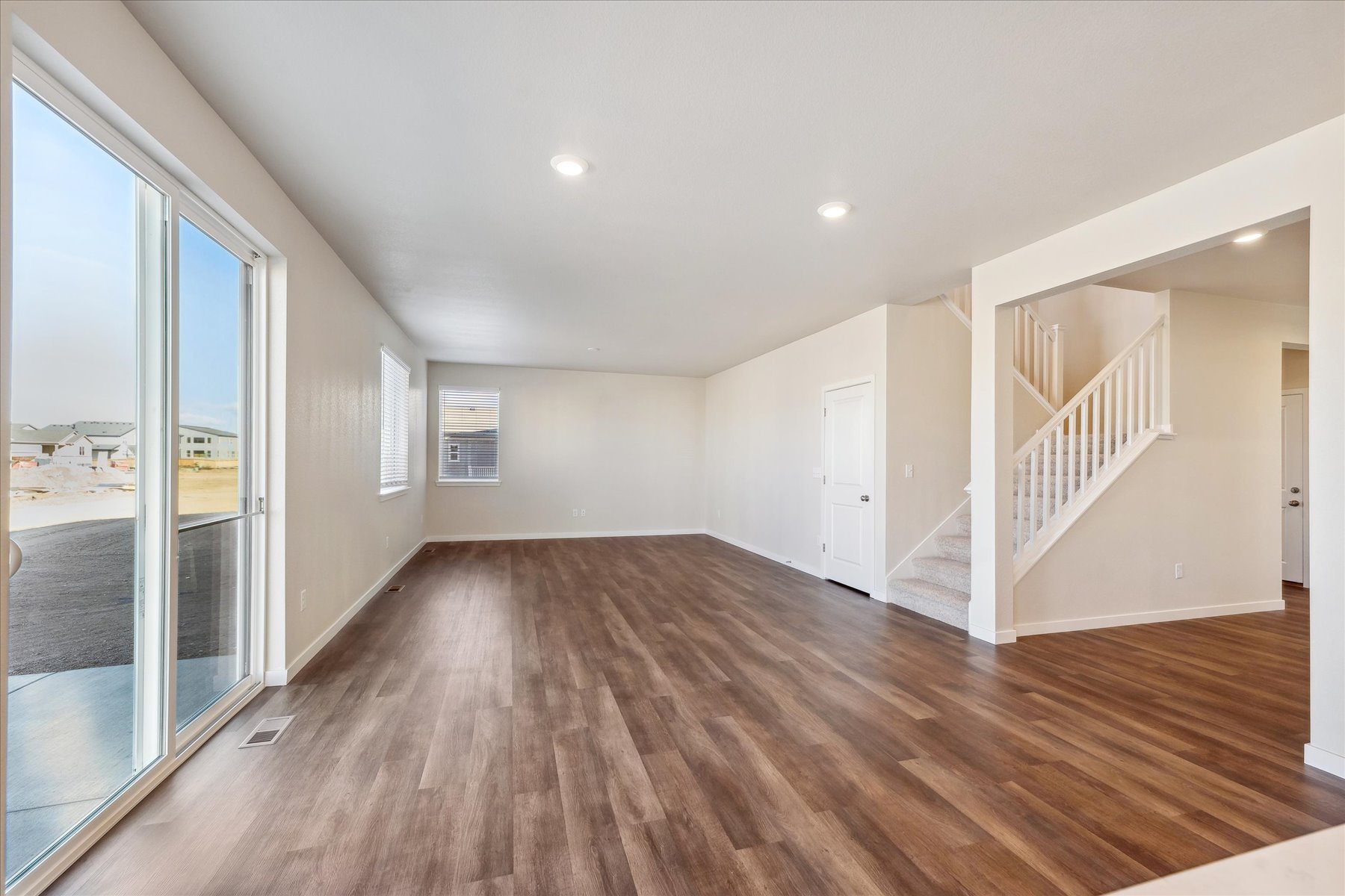 A large room with a wood floor.