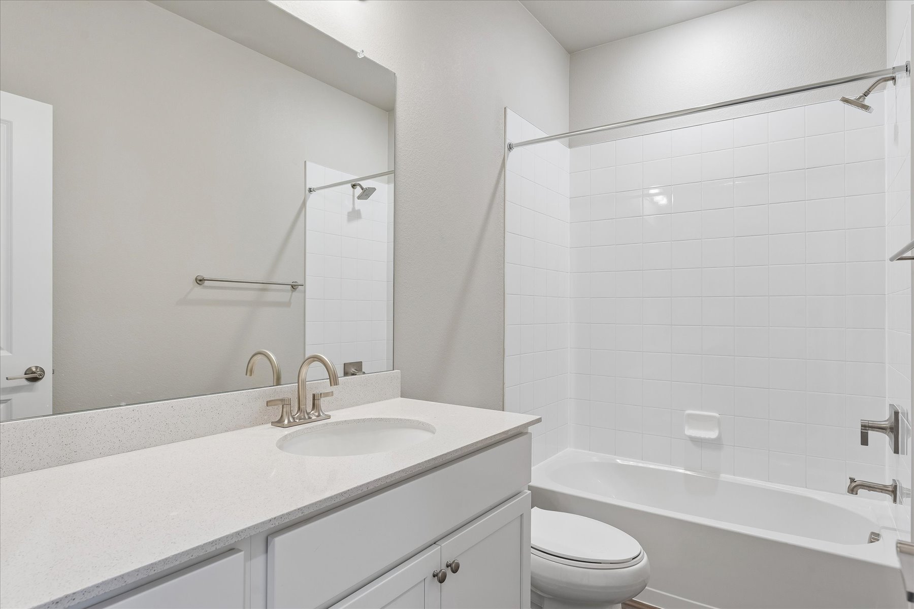 A bathroom with a sink and a toilet.