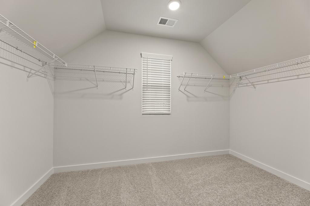 A white room with a staircase.