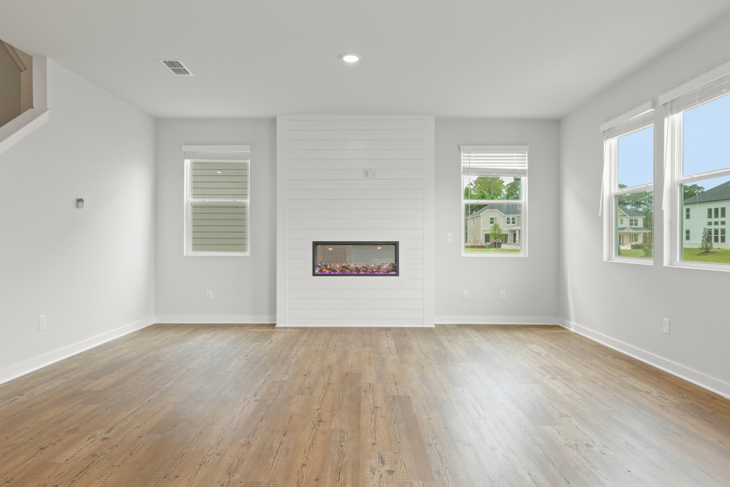A room with white walls and windows.