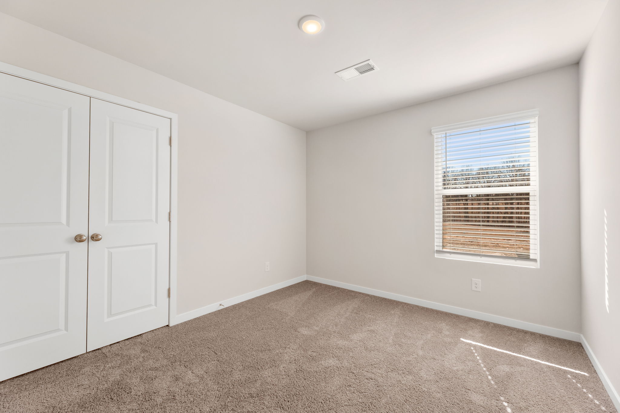 A room with white doors.