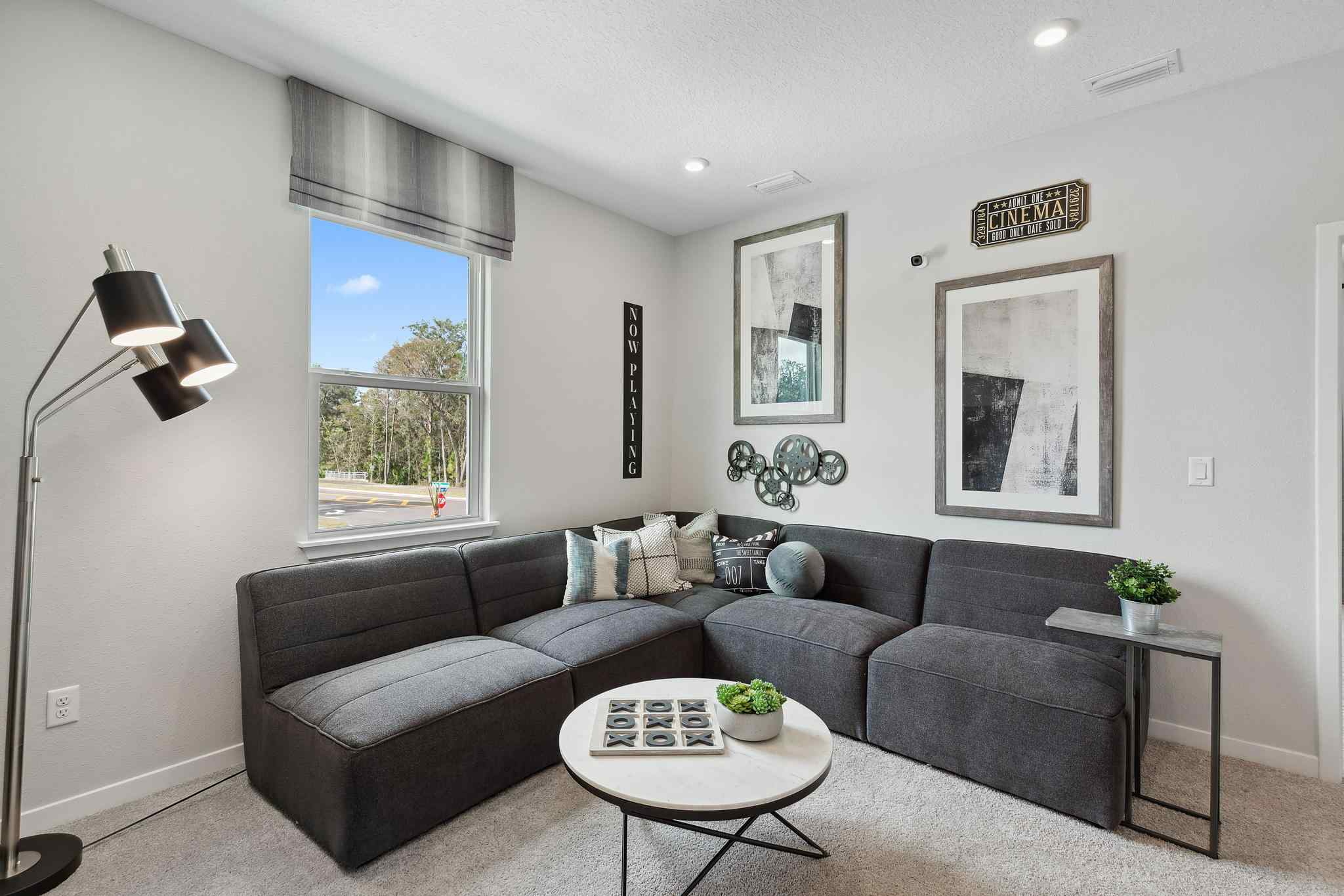 A living room with a couch and a coffee table.