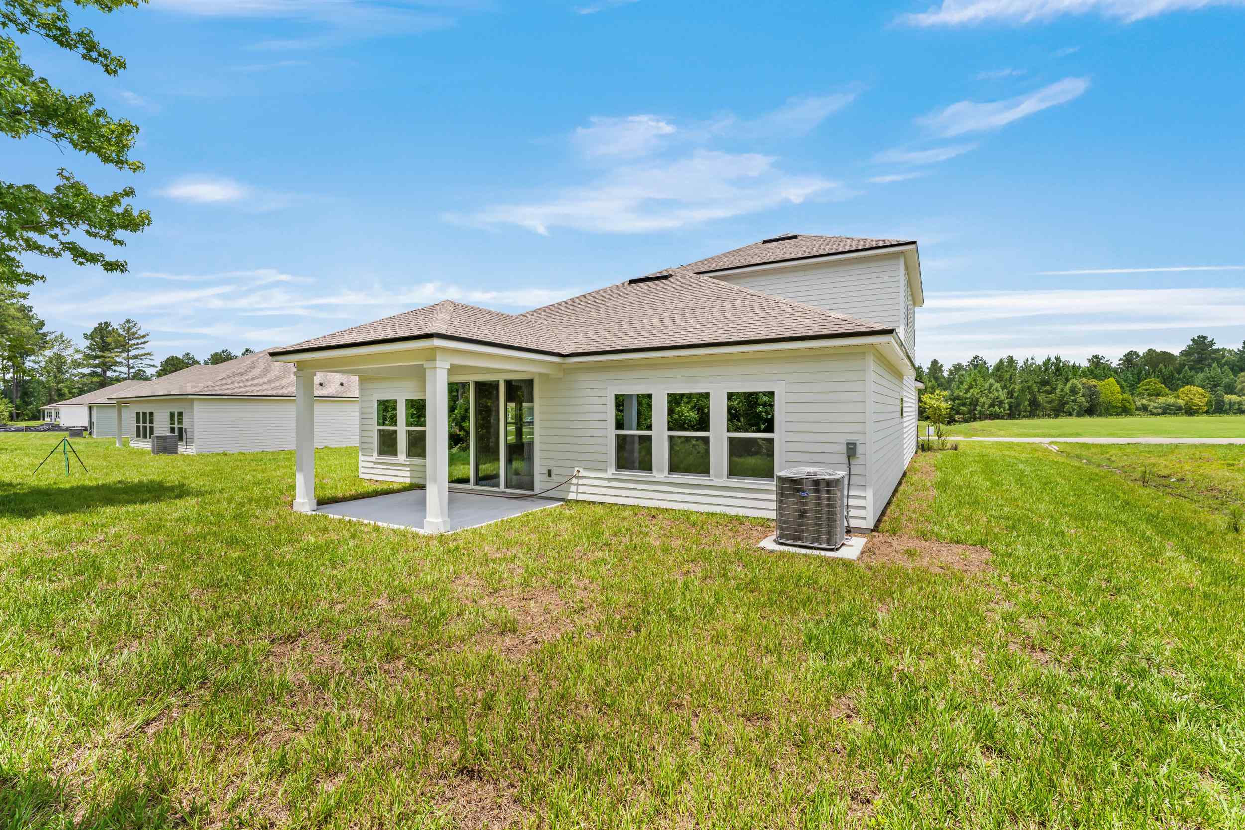 Dogwood Floor Plan Rear Exterior with Covered Patio at NorthShore in Kingsland