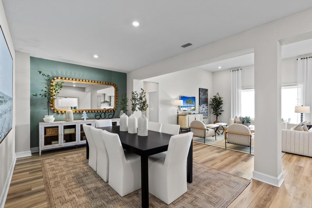 A large living room with a large mirror.