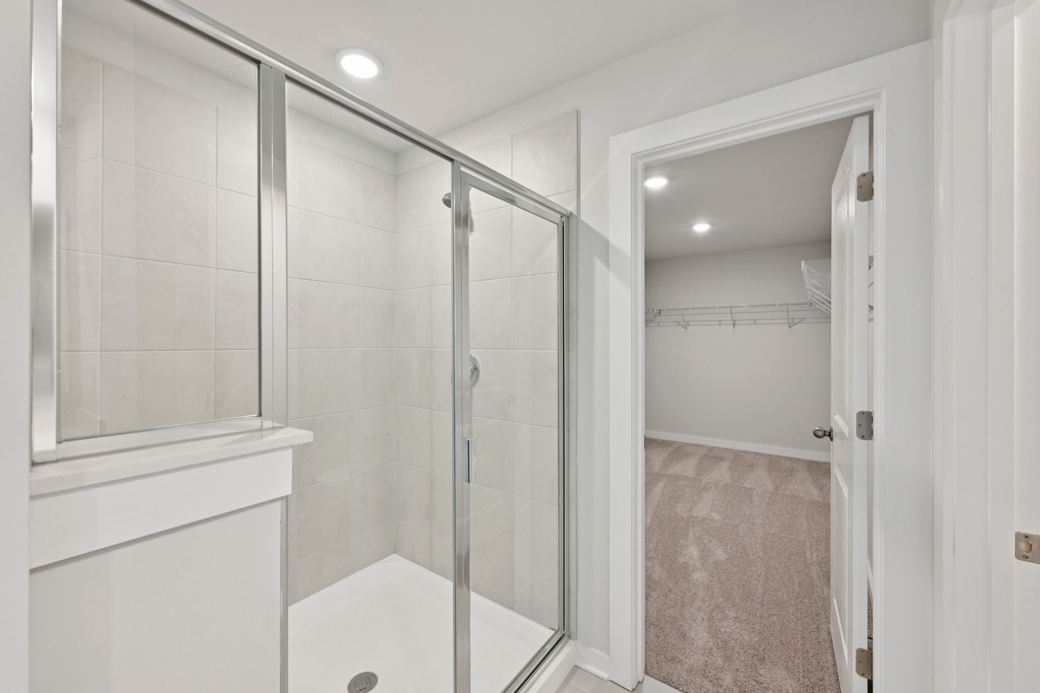 A bathroom with a glass shower.