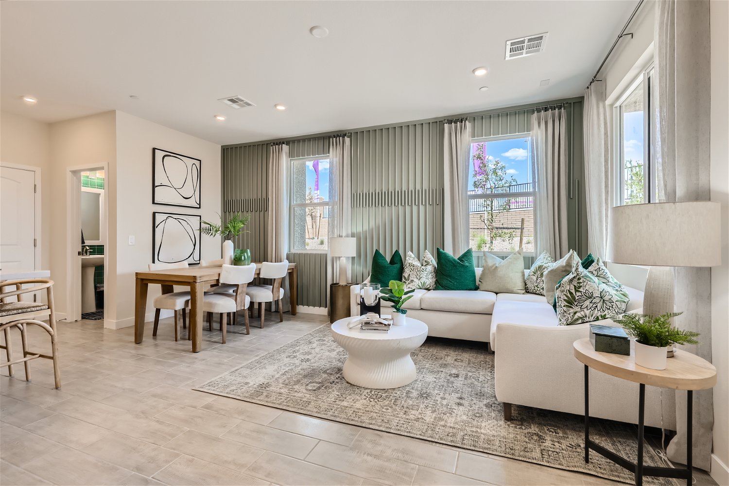 A living room with a large rug.