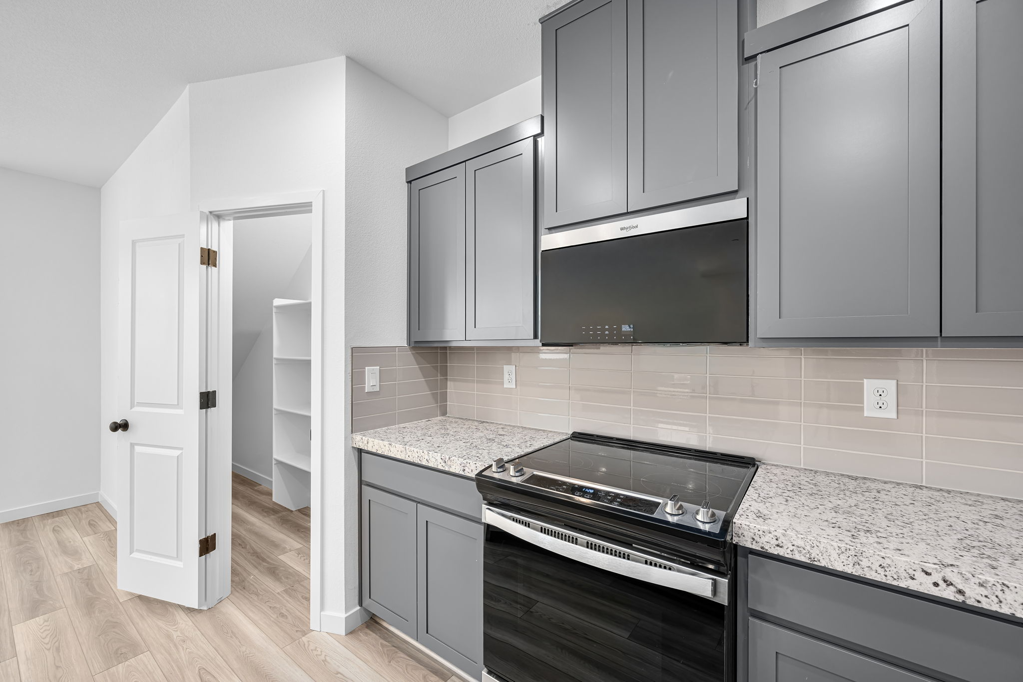 A kitchen with black appliances.