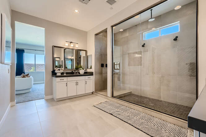 A modern bathroom with a glass shower.