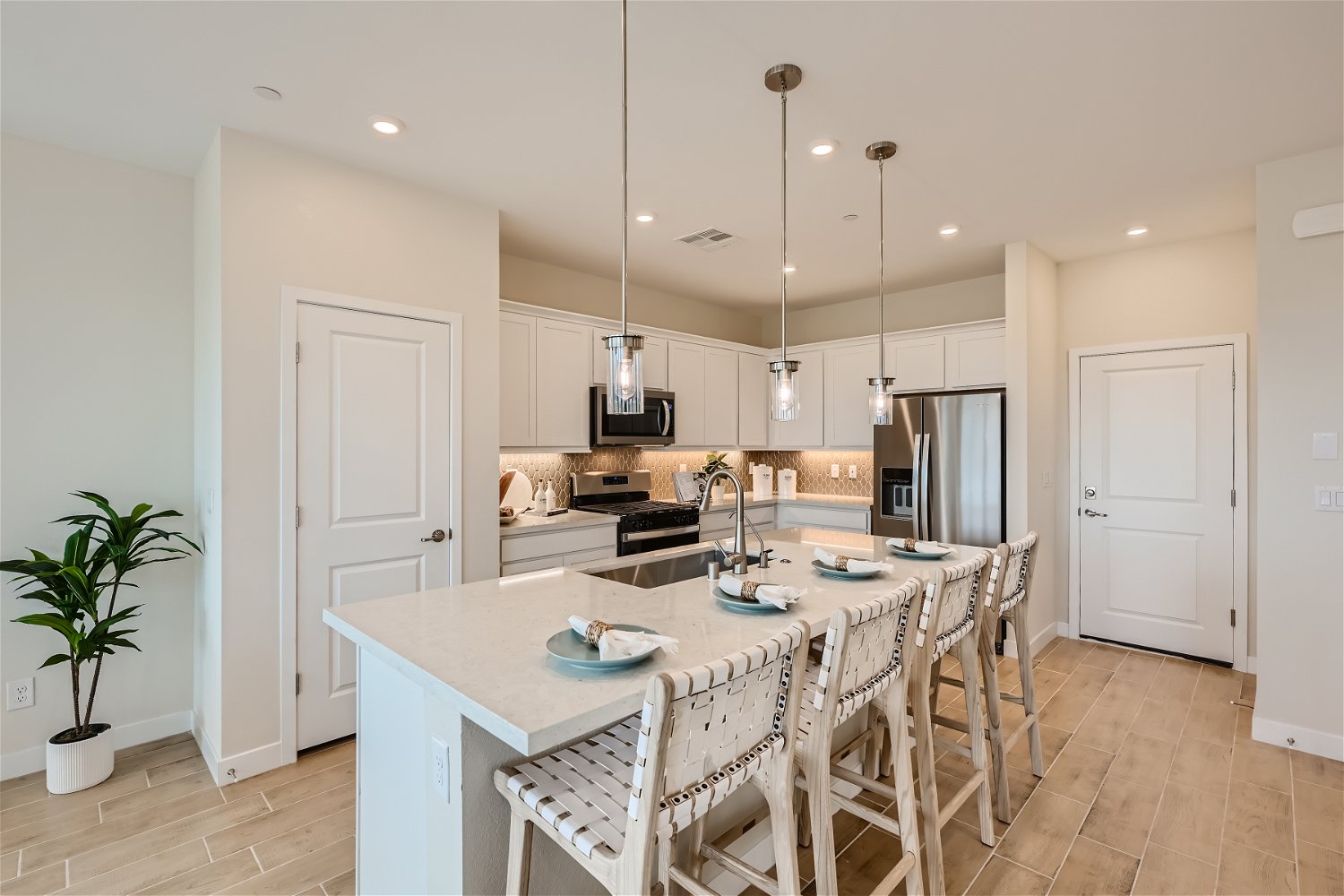 A kitchen with a dining table.