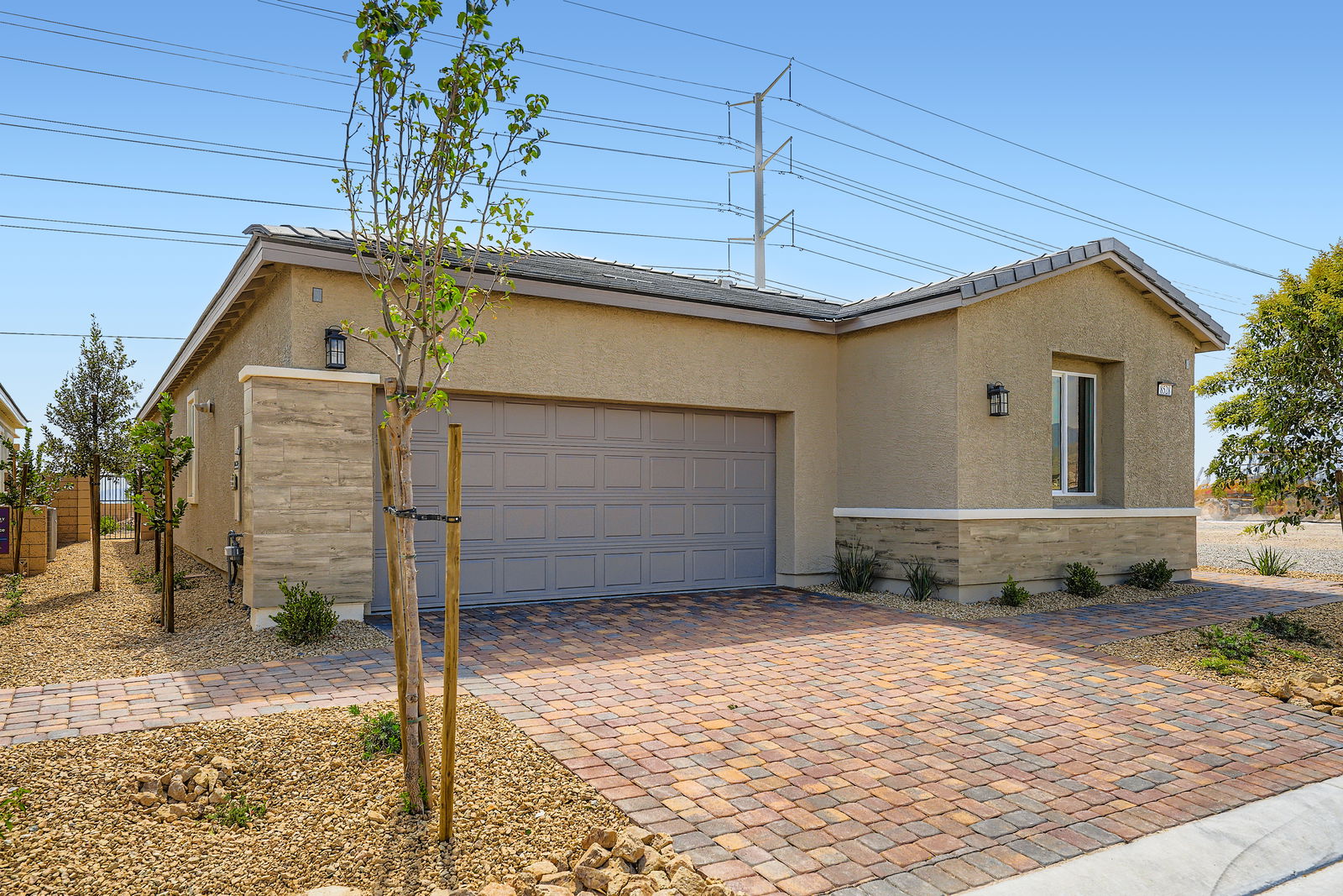 A house with a brick driveway.