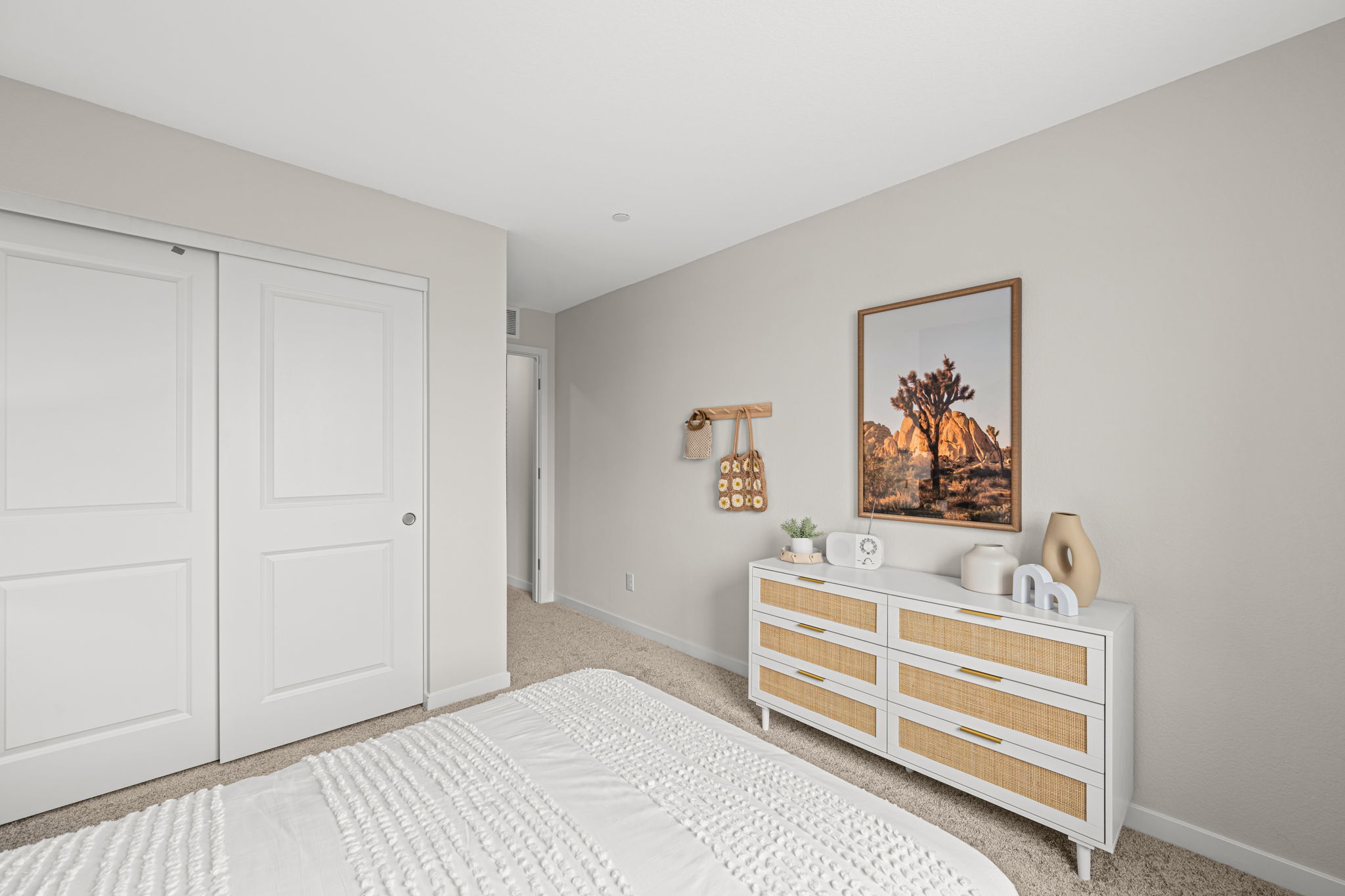 A room with a bed and a table.