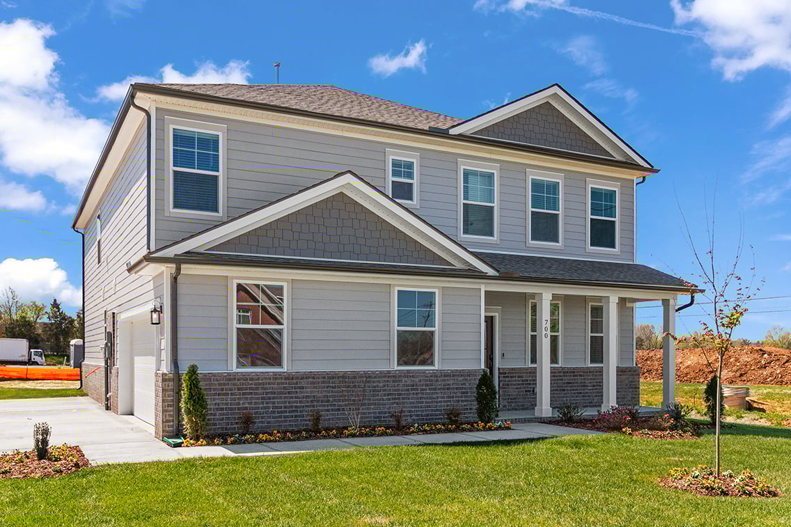 A house with a brick driveway.