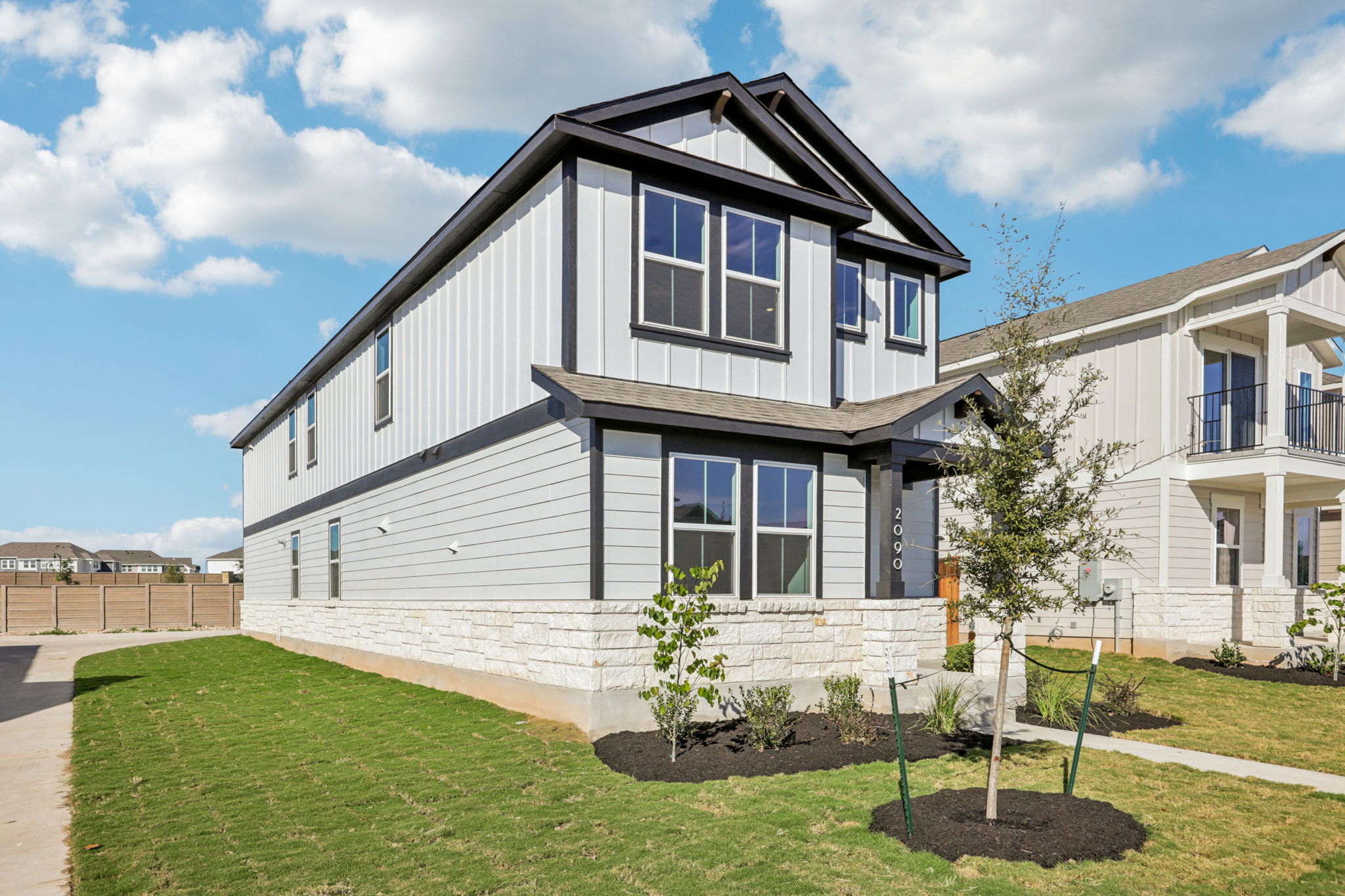 A house with a yard and trees.