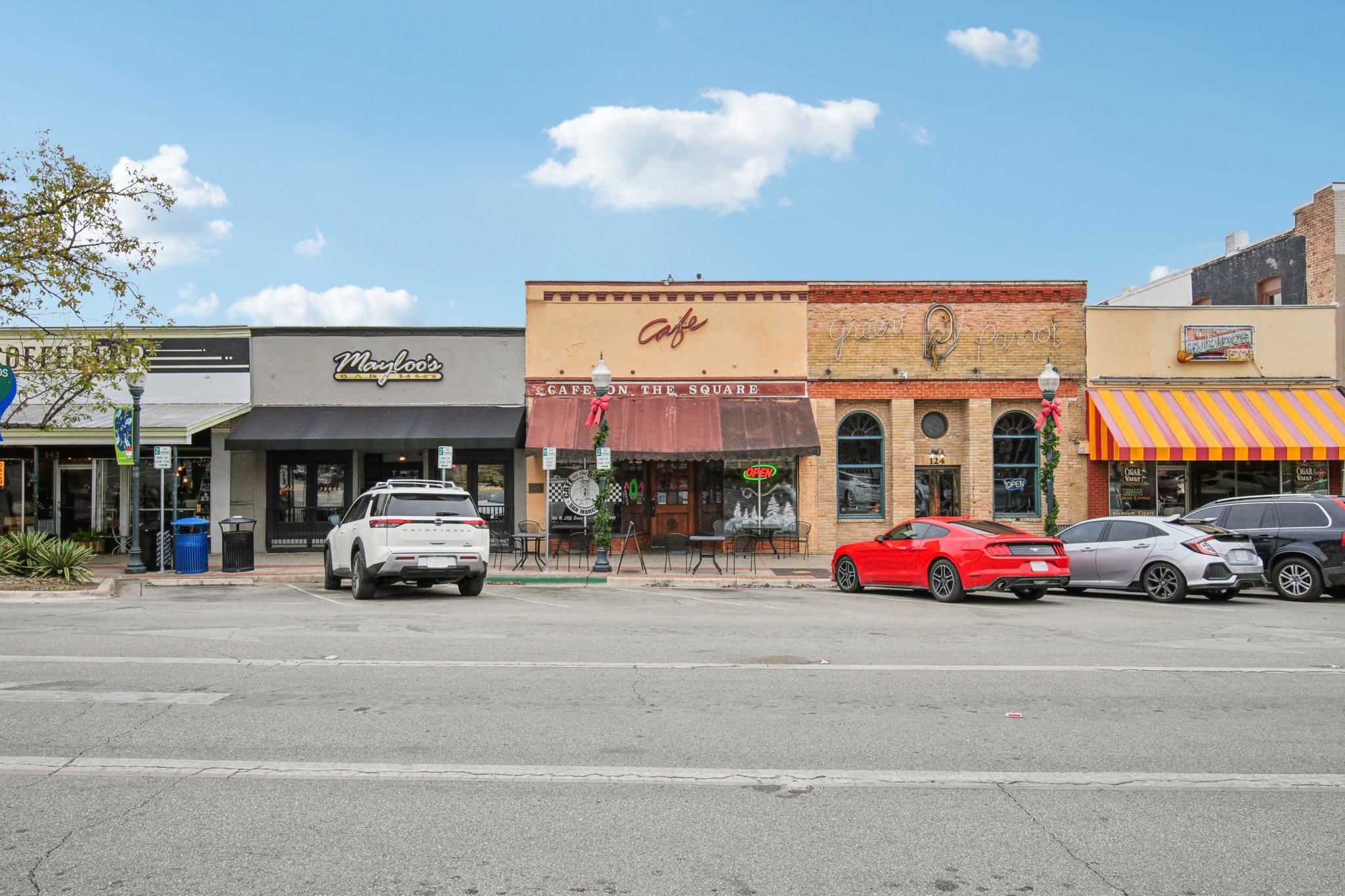 A parking lot in front of a store.