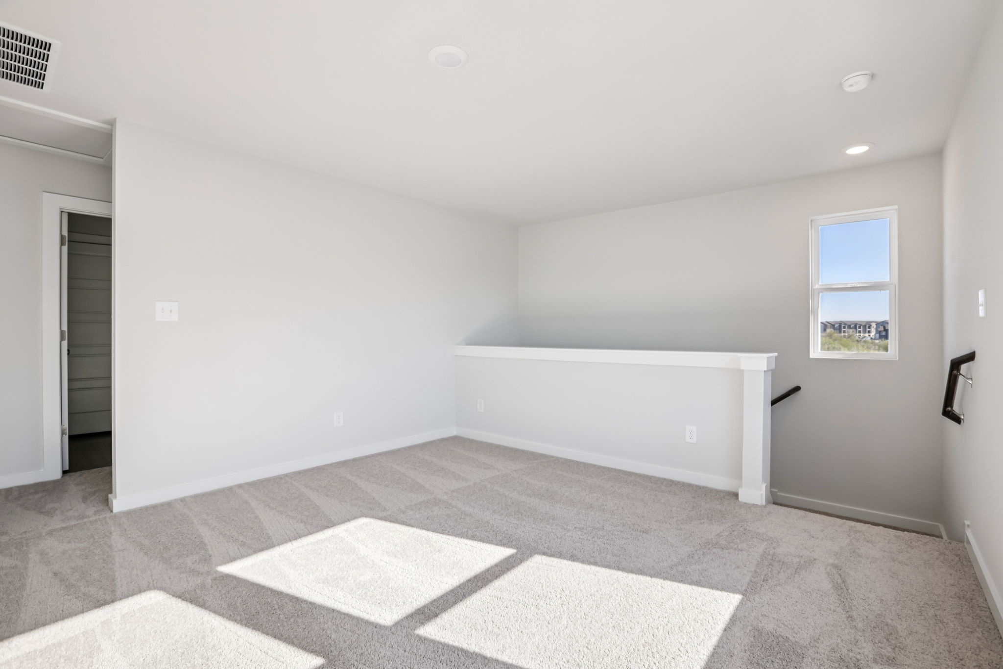 A room with a rug and a rug.