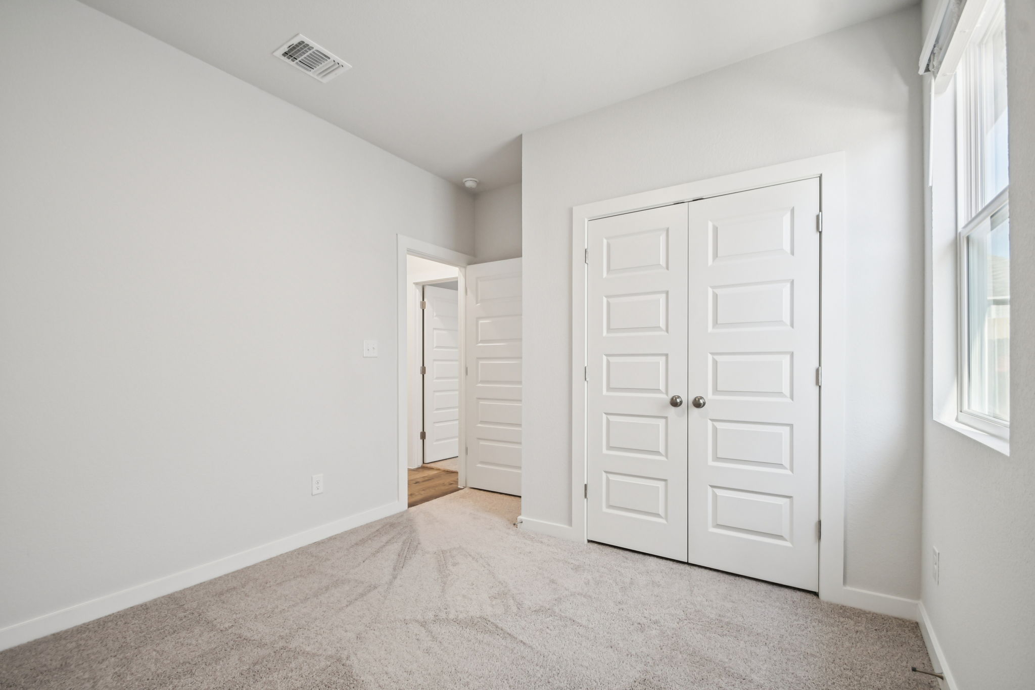 A room with white doors.