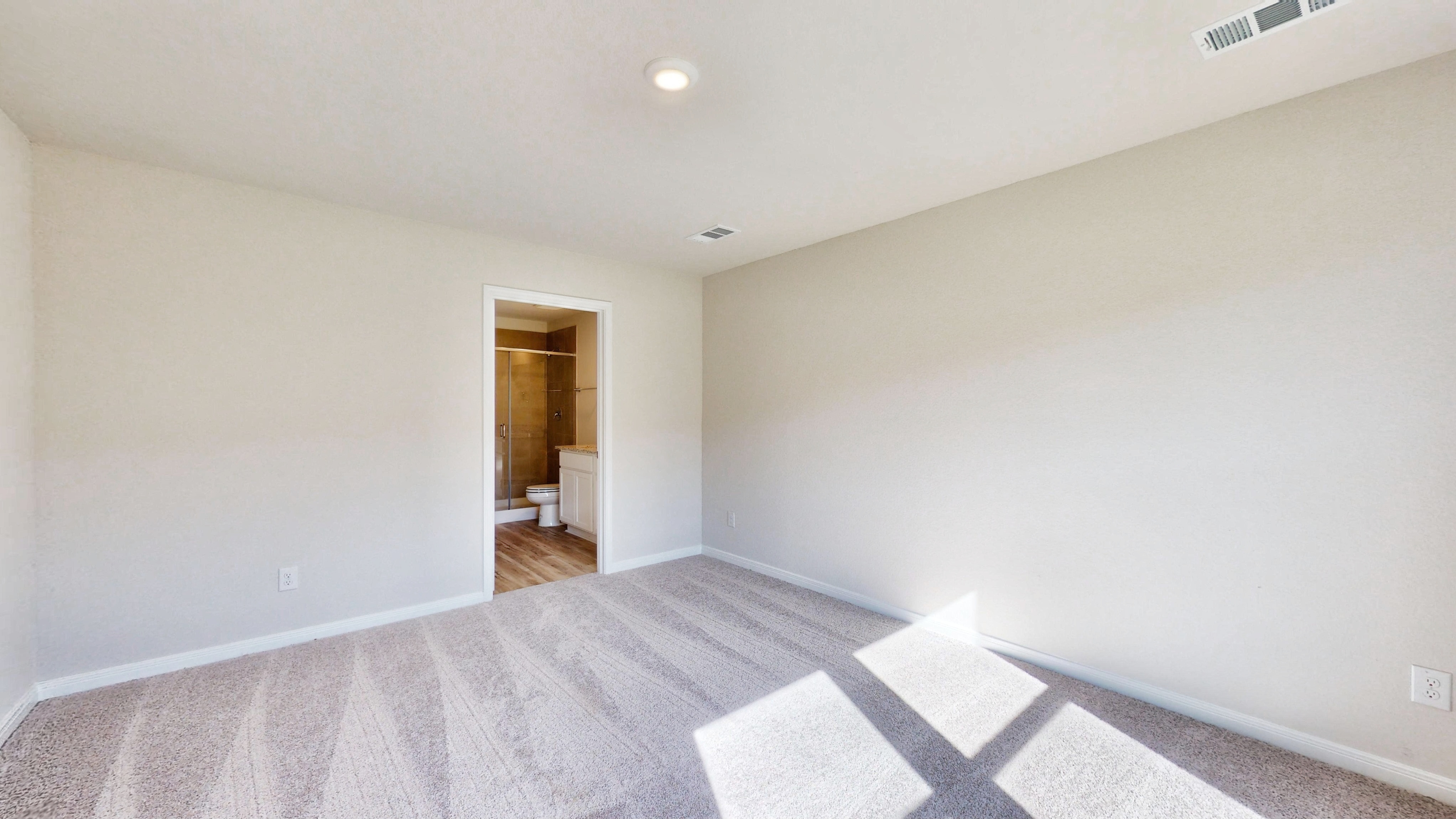 A hallway with a door.