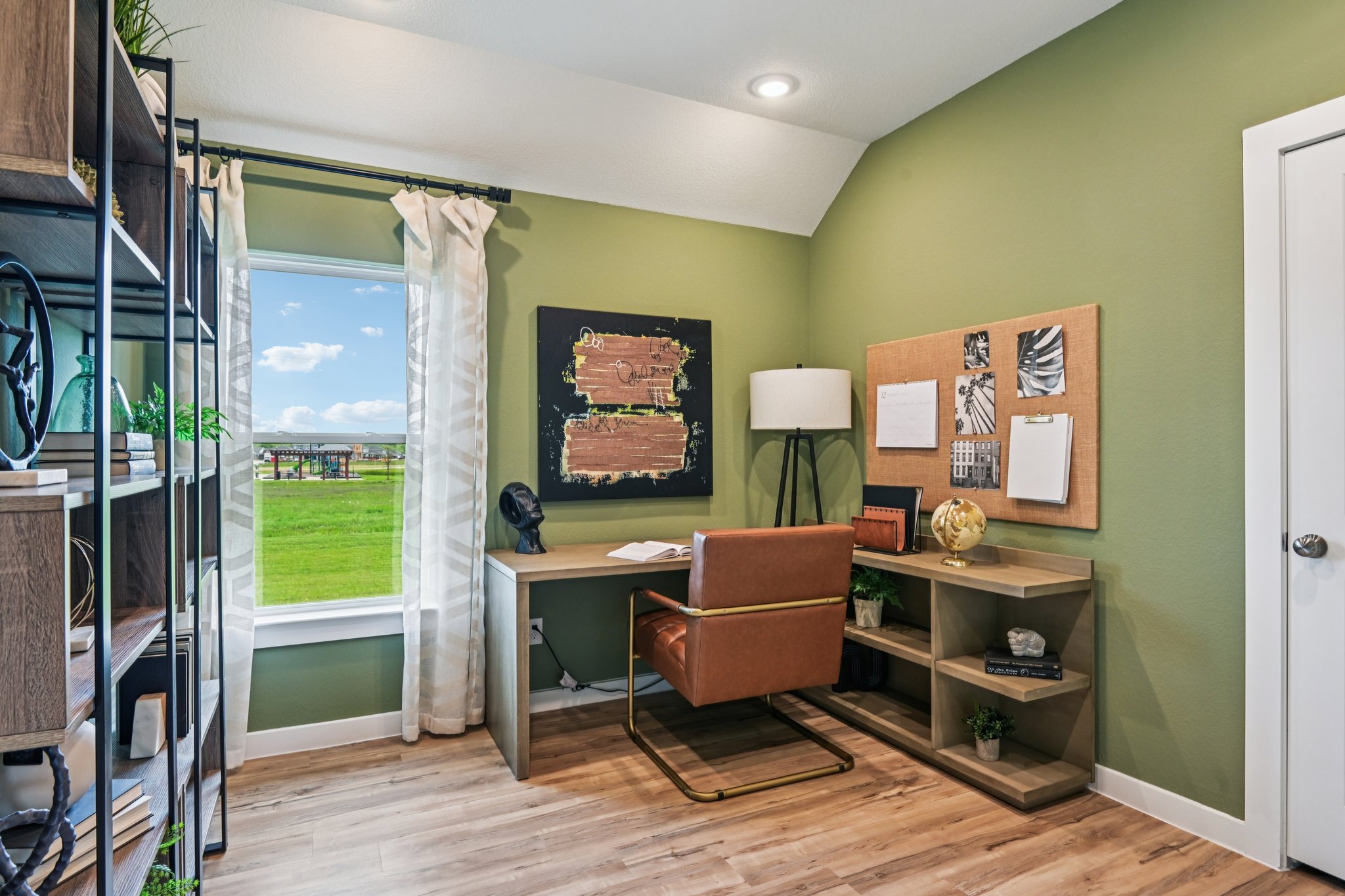 A room with a desk and a chair.