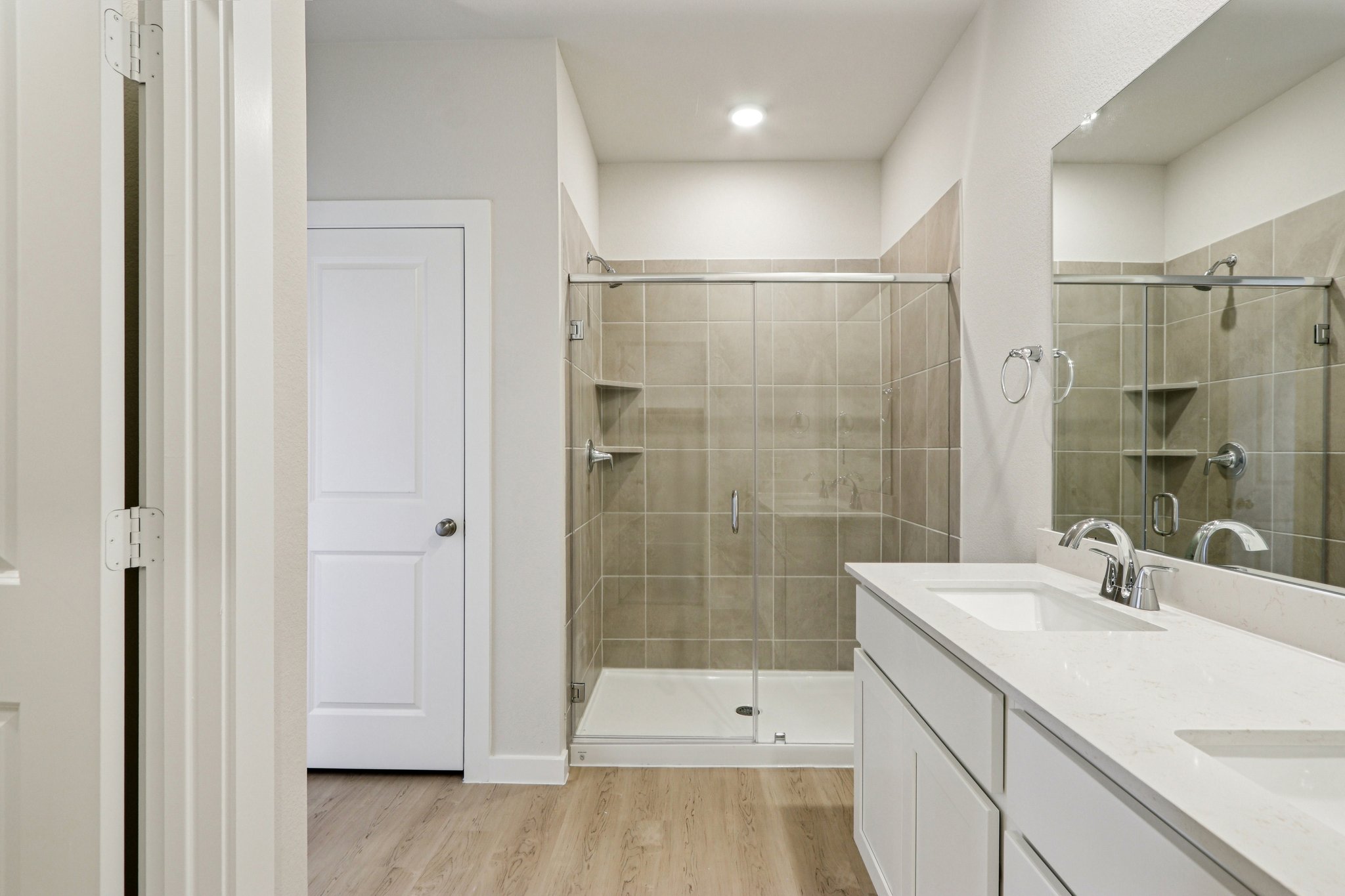 A bathroom with a glass shower.