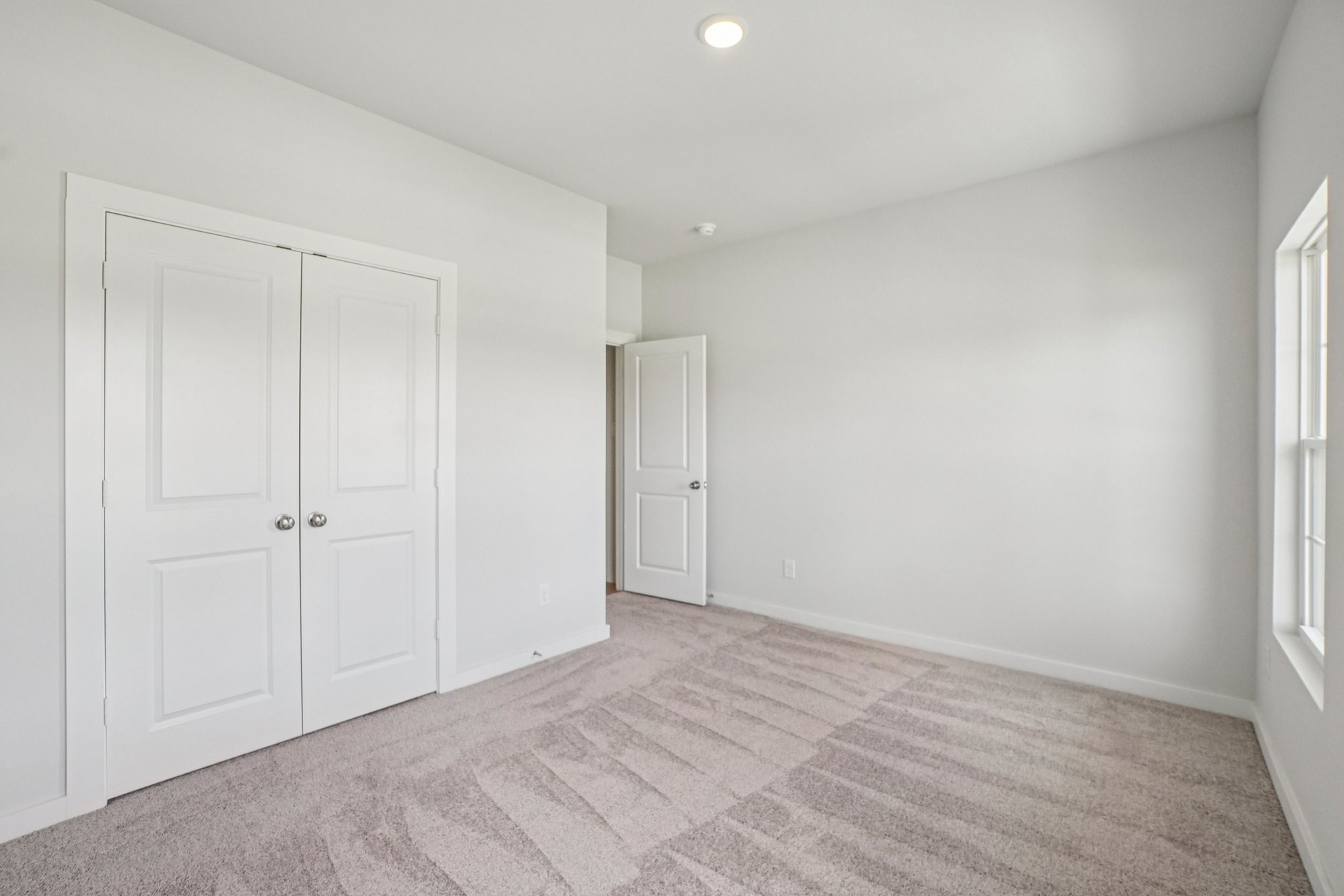 A room with white doors.