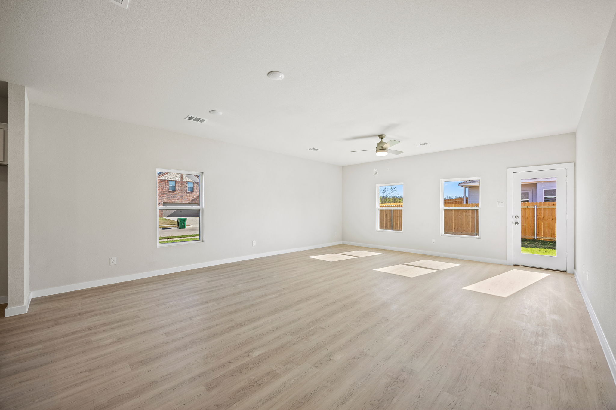 A room with a wood floor and a wood floor.