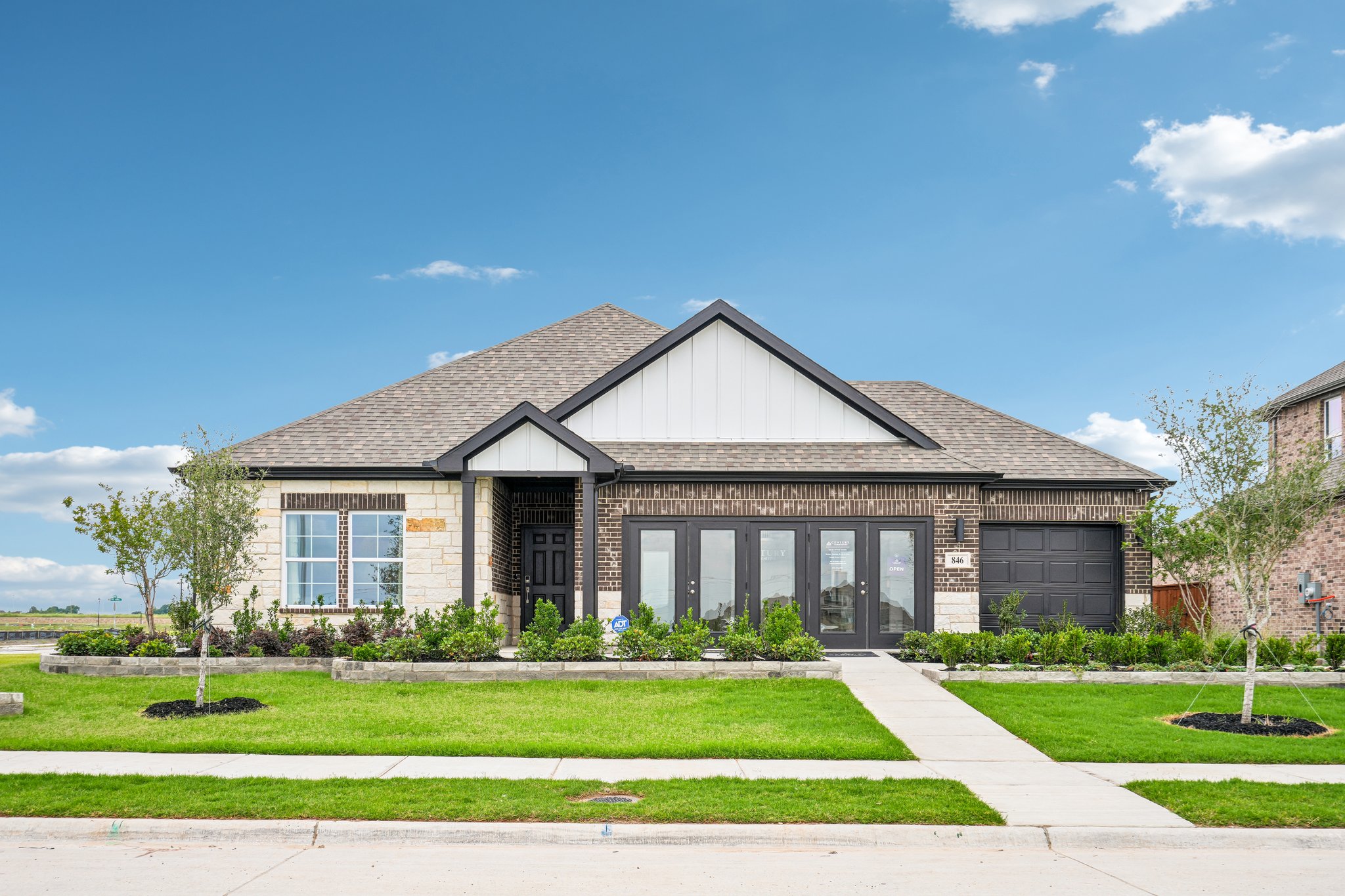 A house with a lawn and trees.