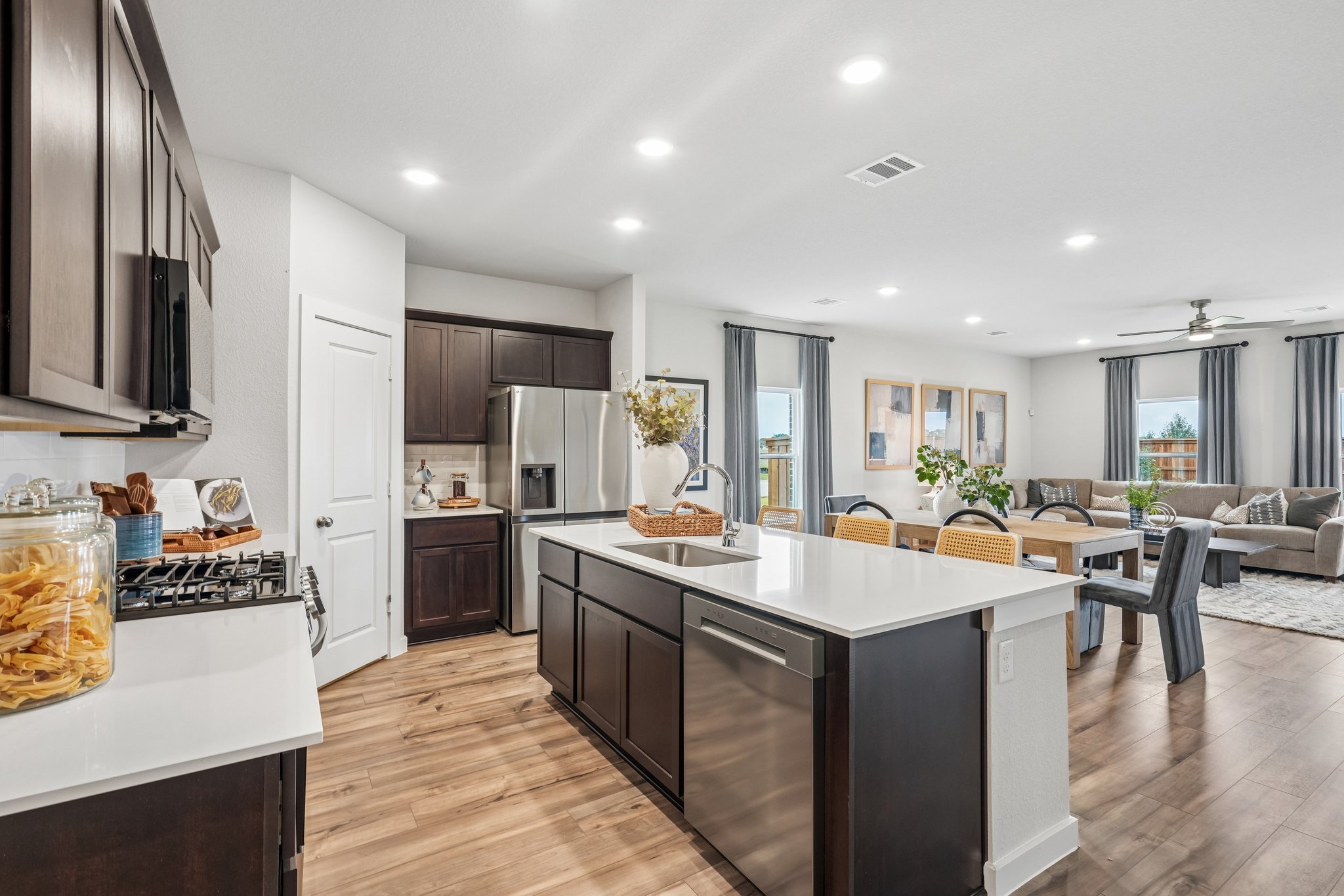 A kitchen with a bar and island.