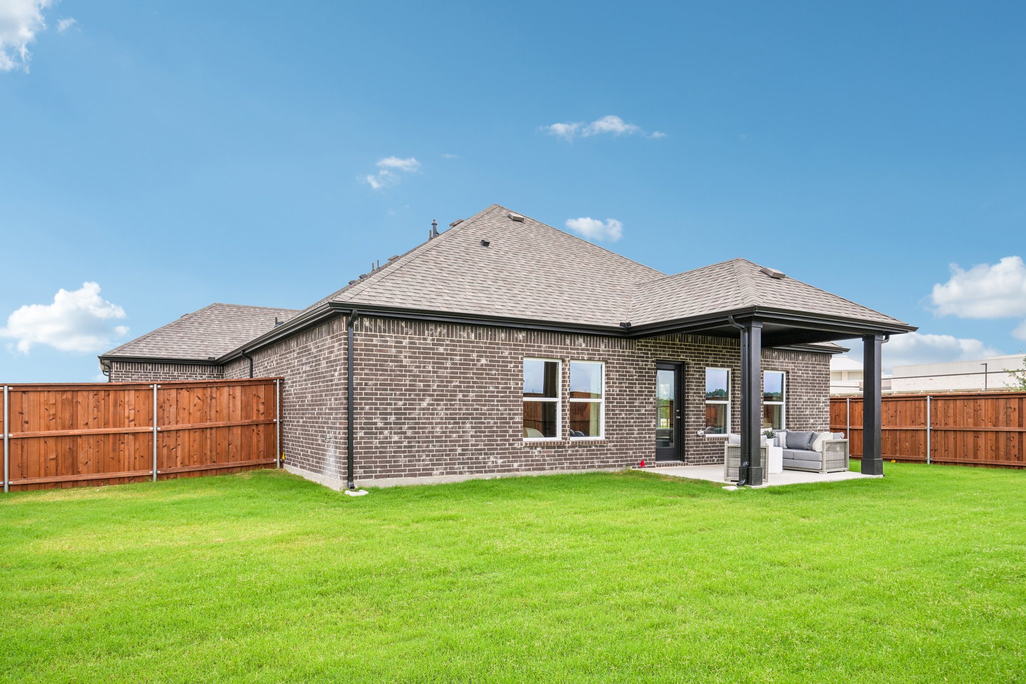 A house with a grass yard.