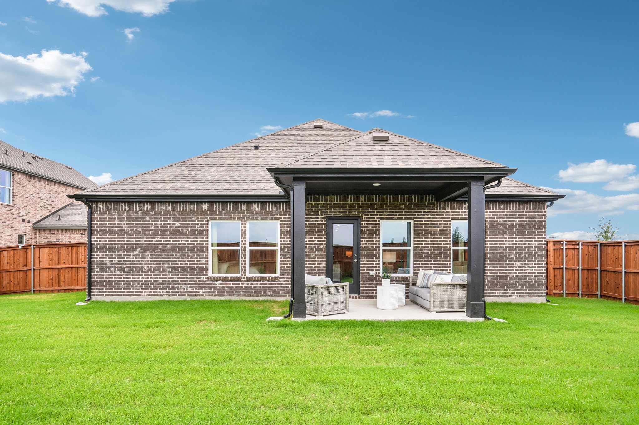 A house with a grass yard.