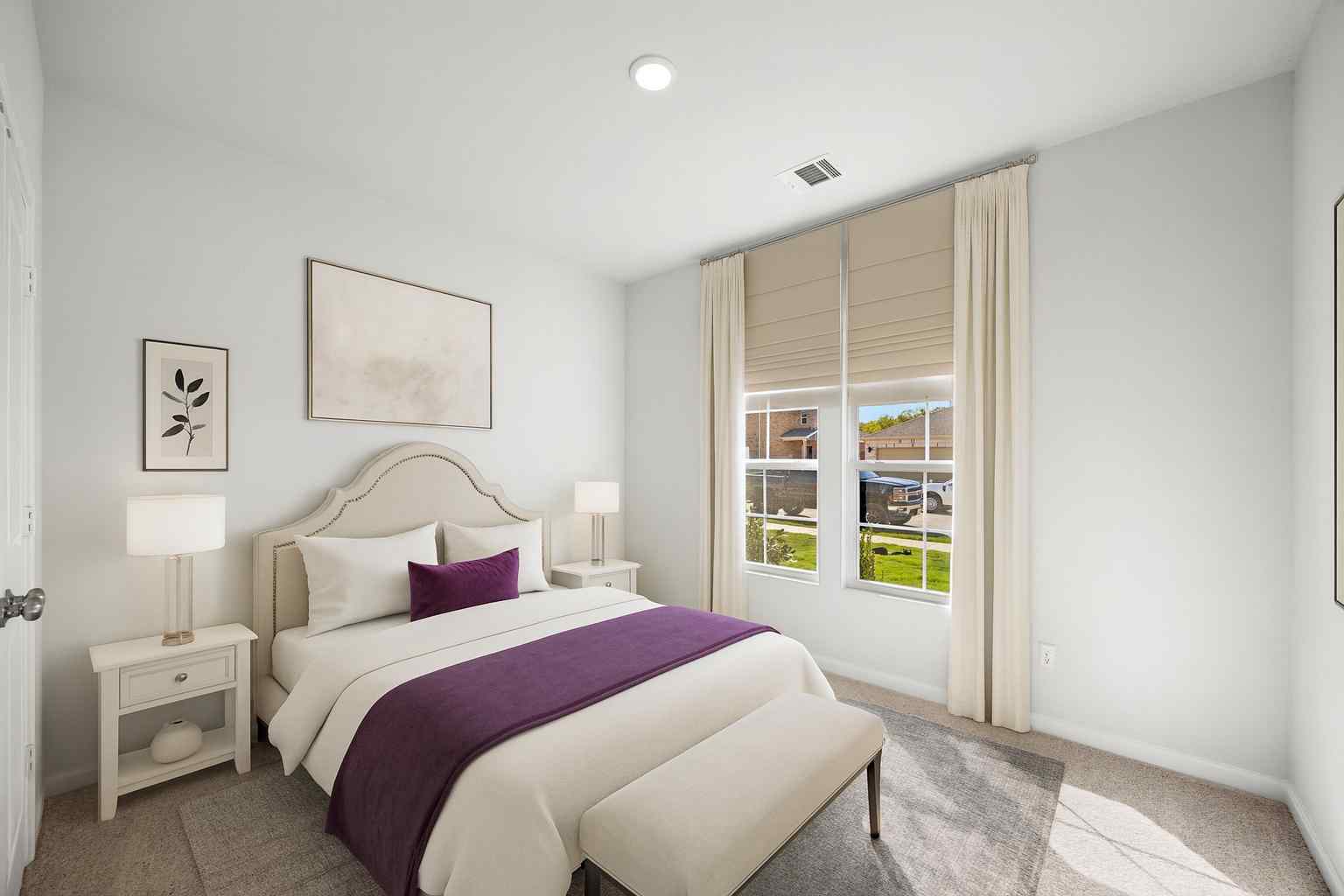 A bedroom with a bed and a window.